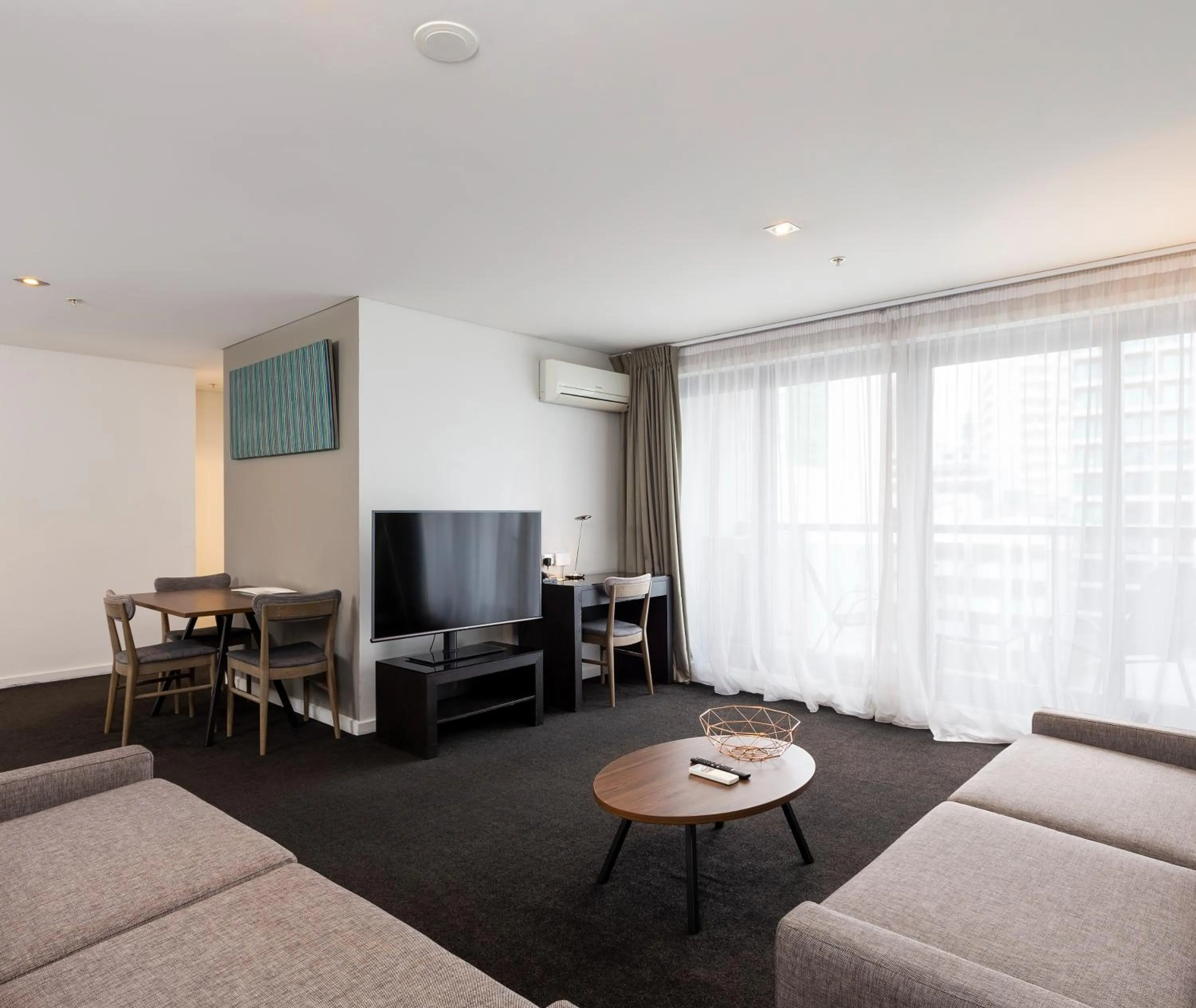 Living room in Oaks Auckland Hotel