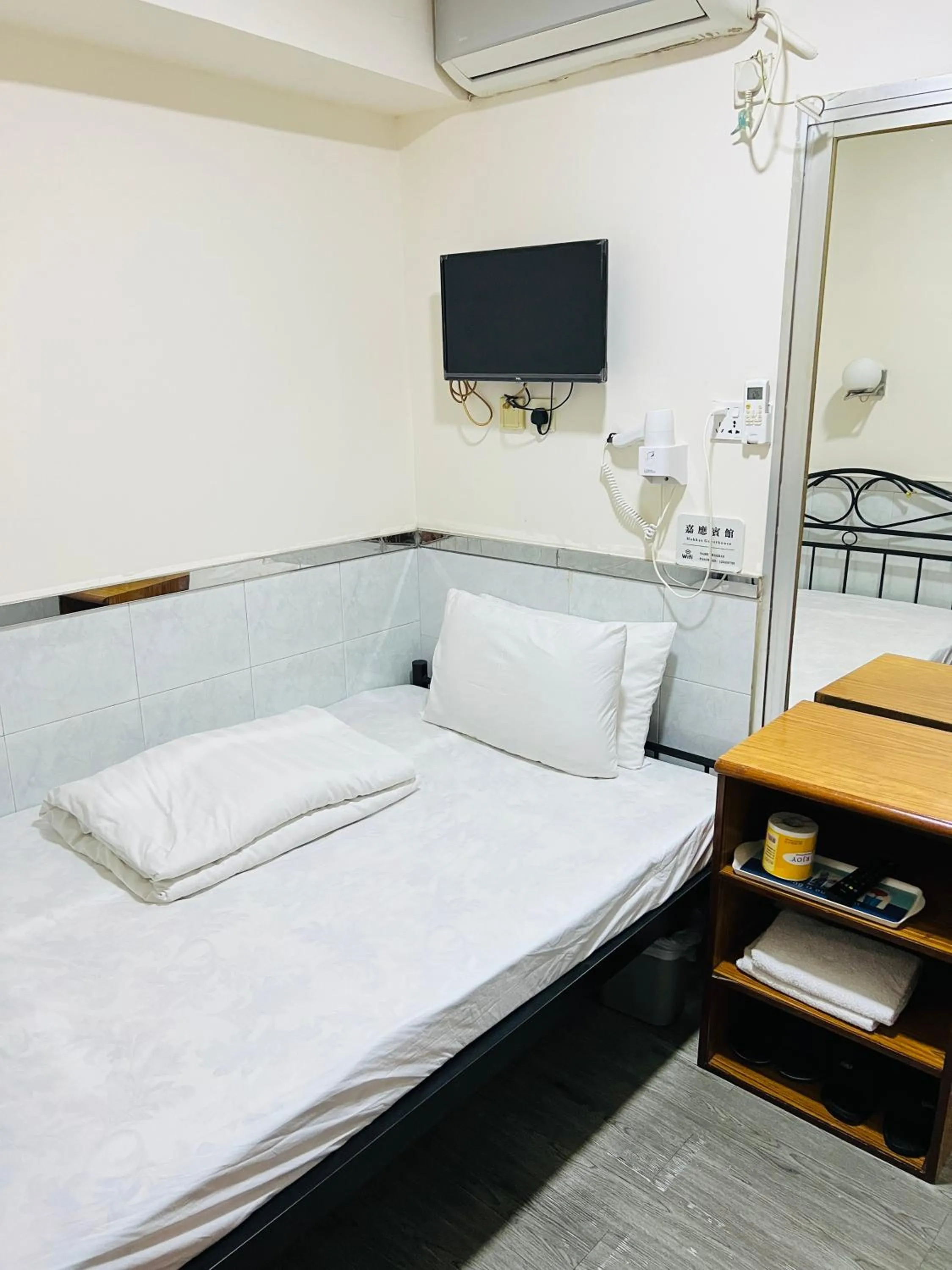 Bed in 嘉應賓館HAKKAS GUEST House