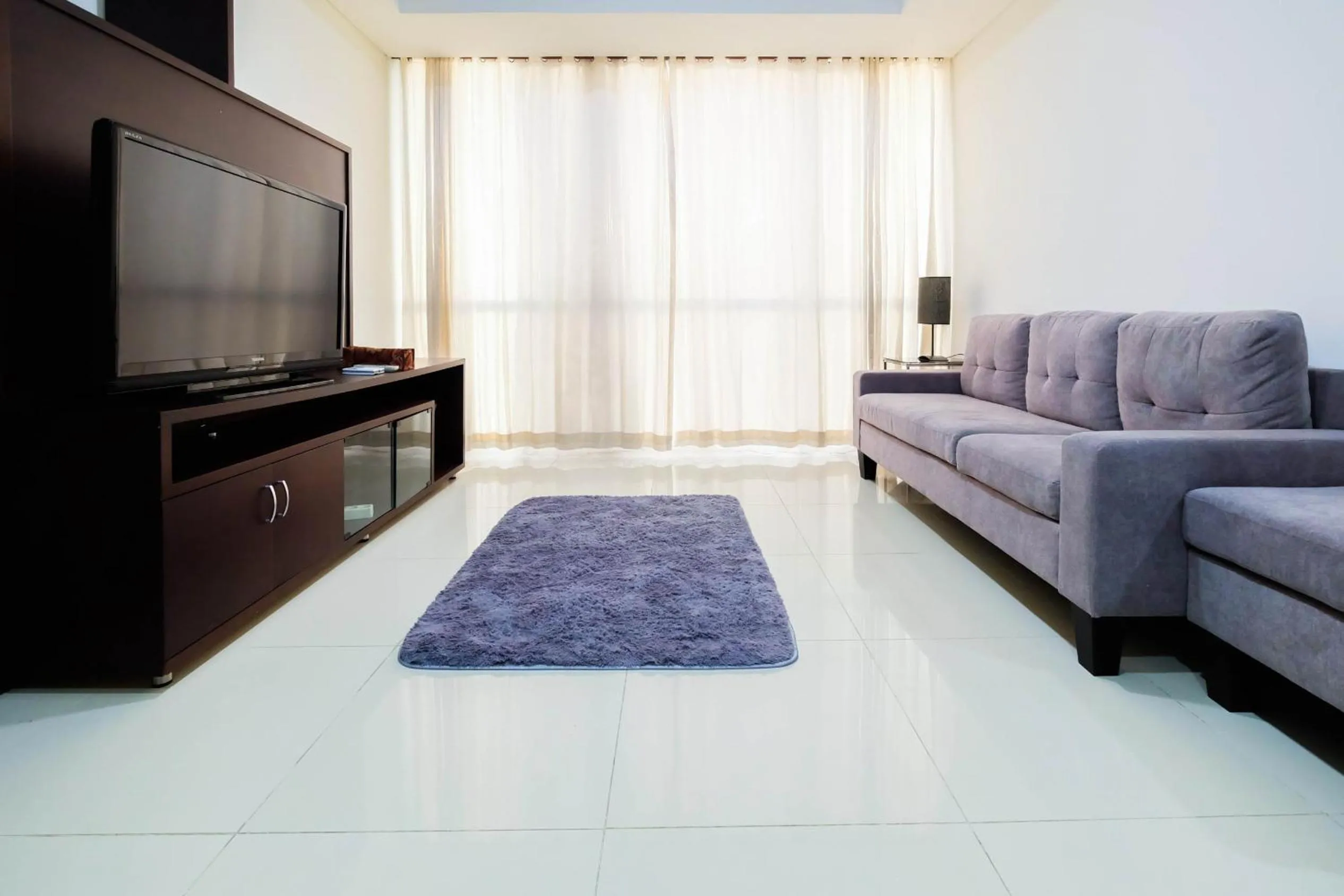 Living room in Luxurious Furnished 2BR Kemang Village Apartment By Travelio