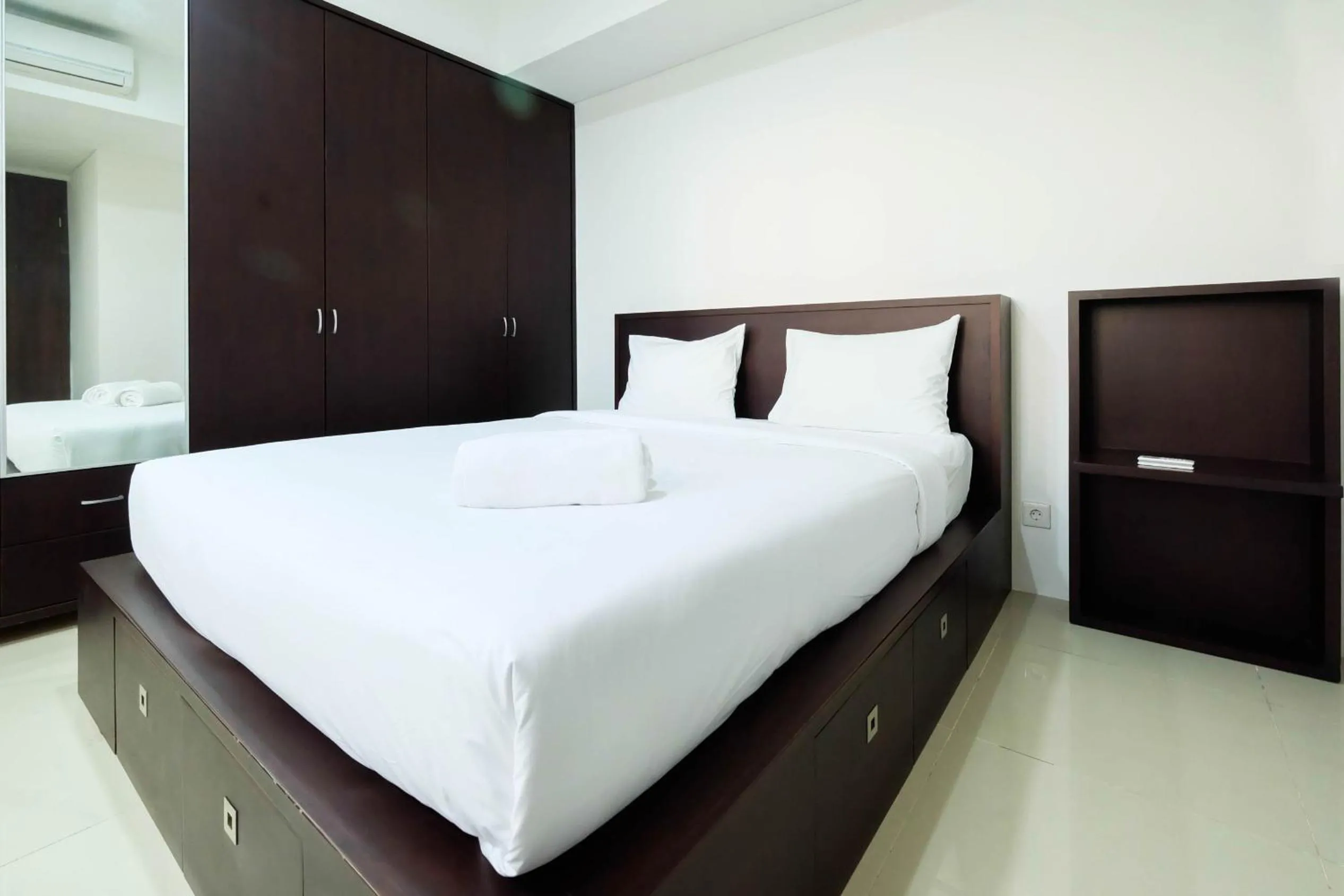Bed in Luxurious Furnished 2BR Kemang Village Apartment By Travelio