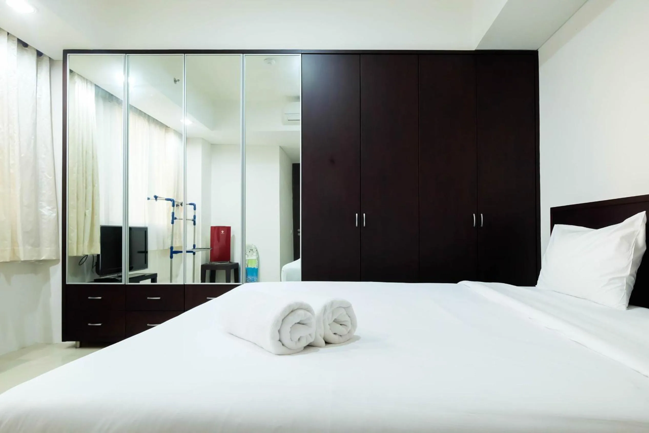 Bed in Luxurious Furnished 2BR Kemang Village Apartment By Travelio
