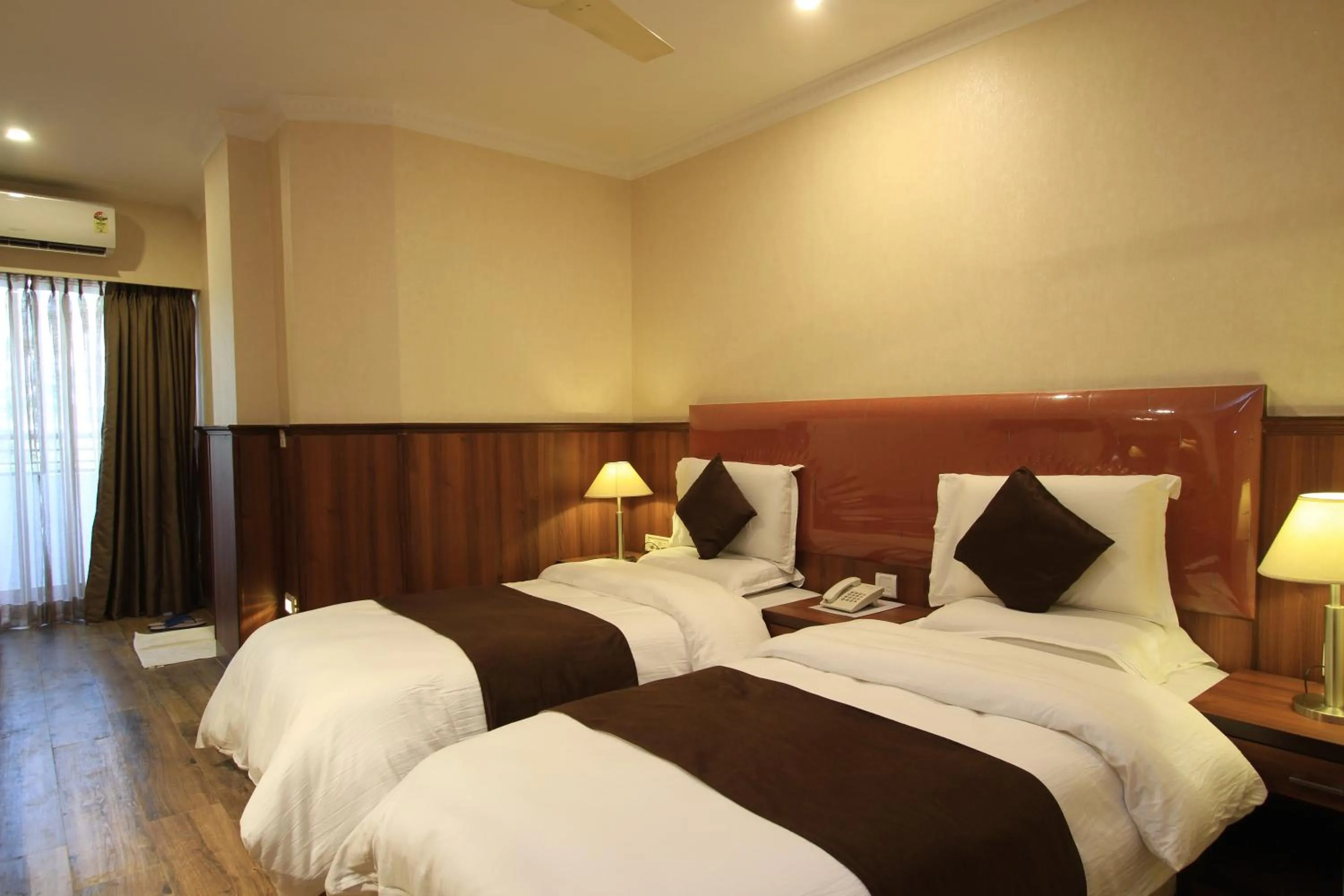 Bed in Hotel Noor Empire International Kormangala