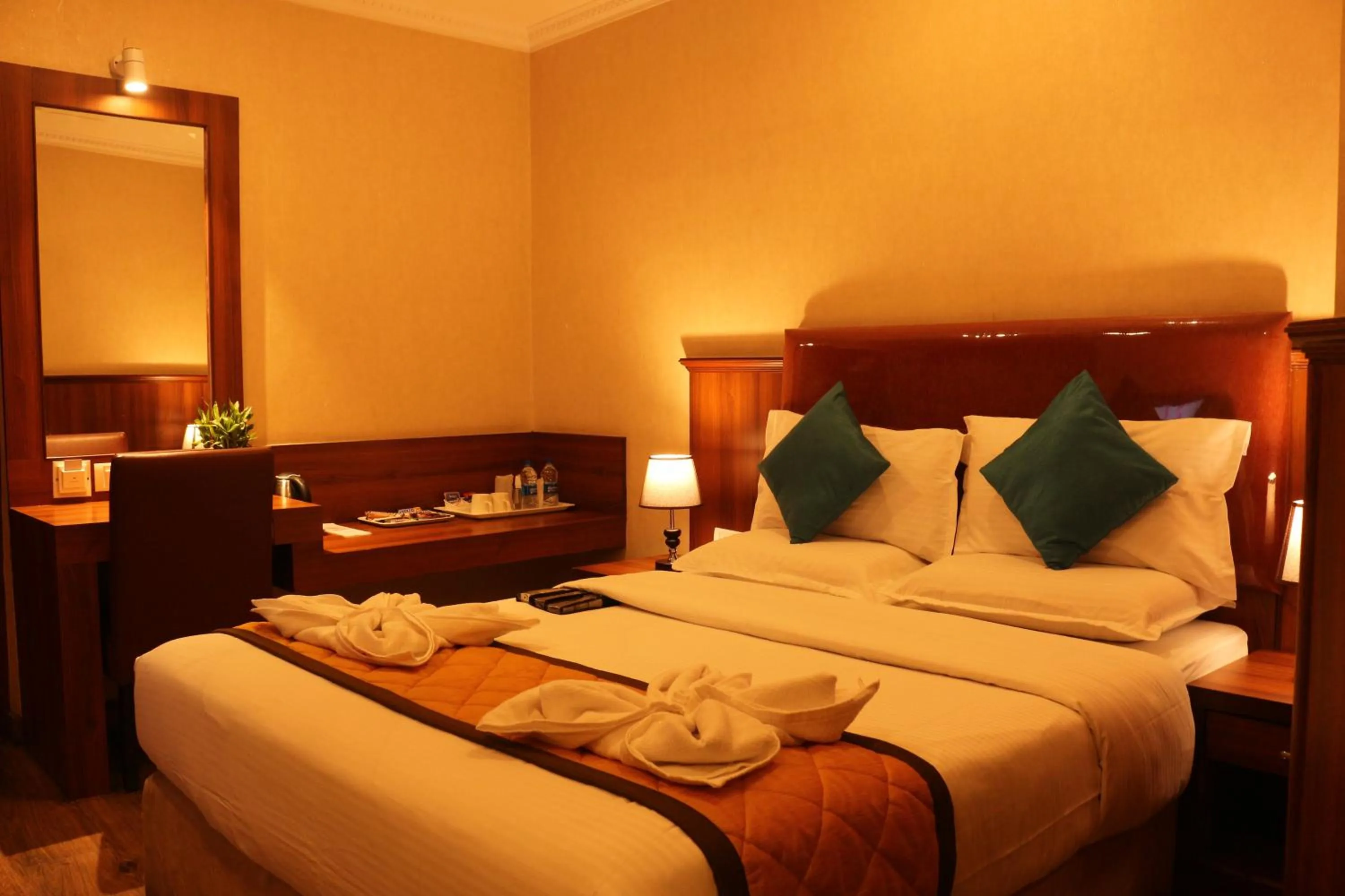 Bed in Hotel Noor Empire International Kormangala