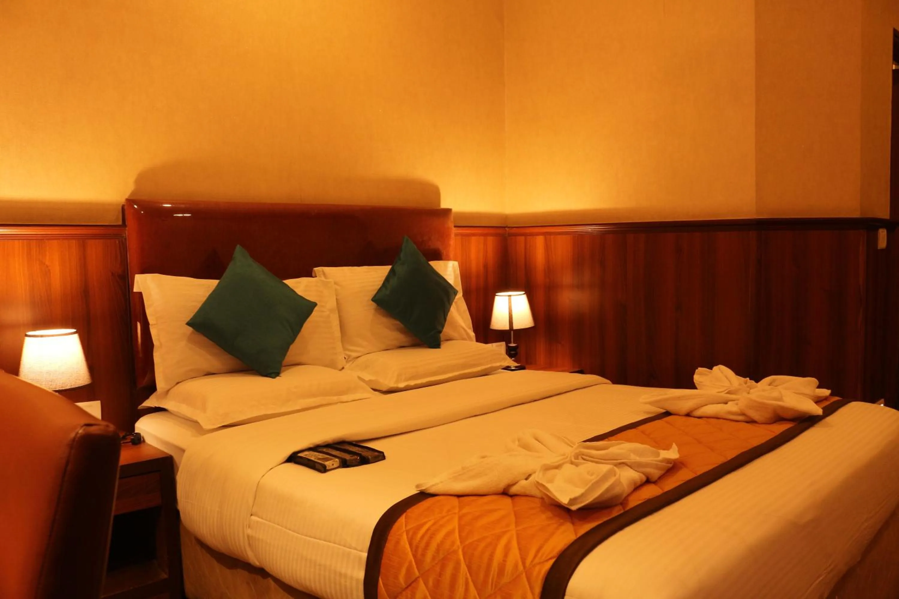 Bed in Hotel Noor Empire International Kormangala