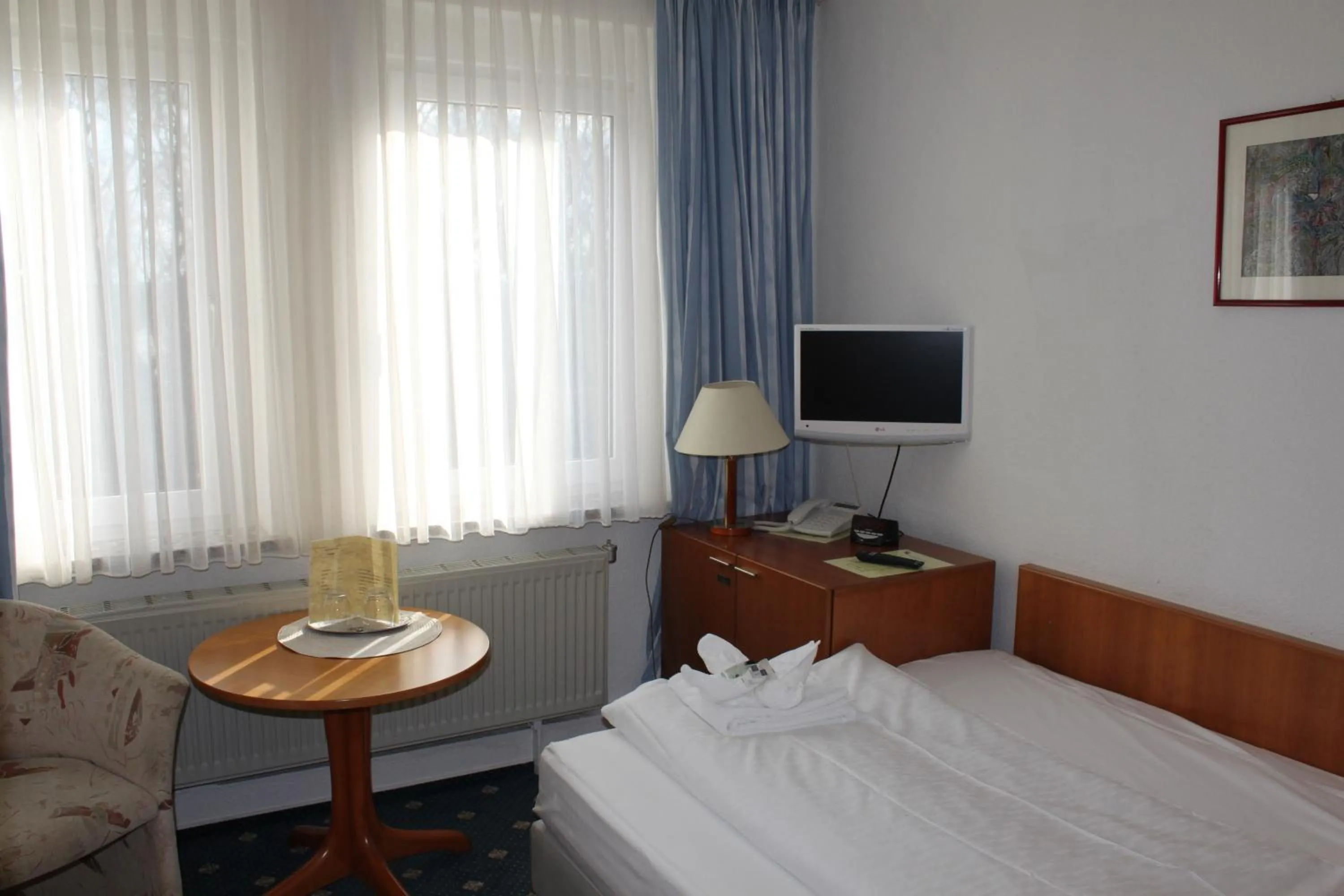 Photo of the whole room, Bed in Kur- und Ferienhotel Sanddorn