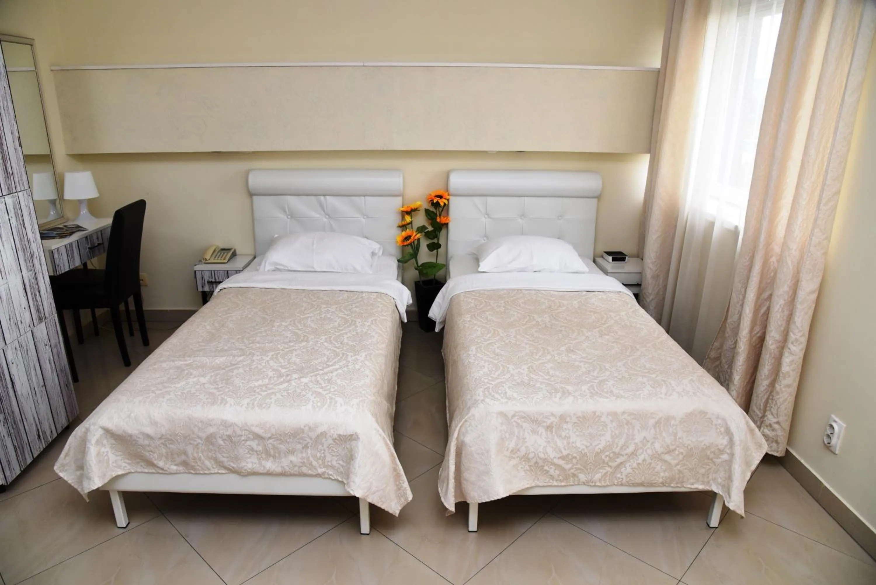 Bed in Garni Hotel Dash