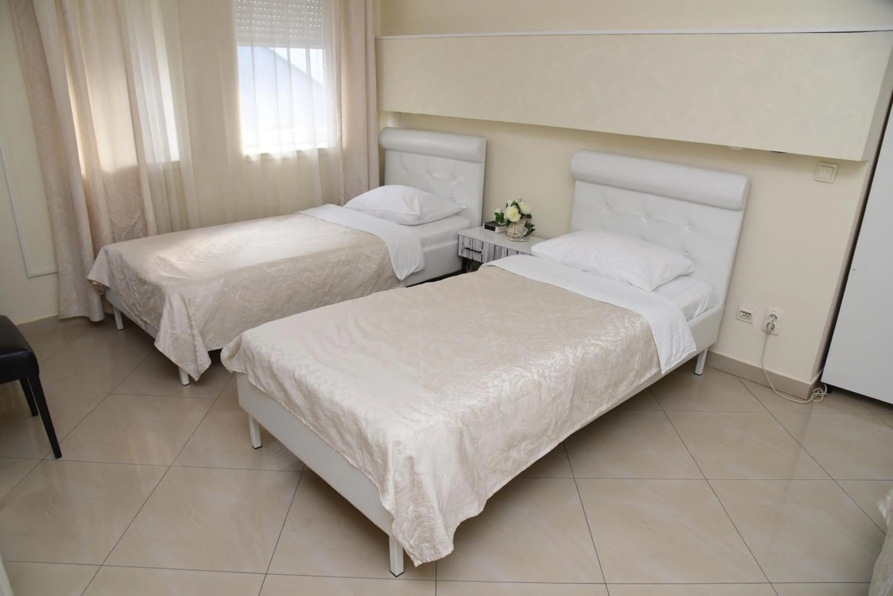 Bed in Garni Hotel Dash