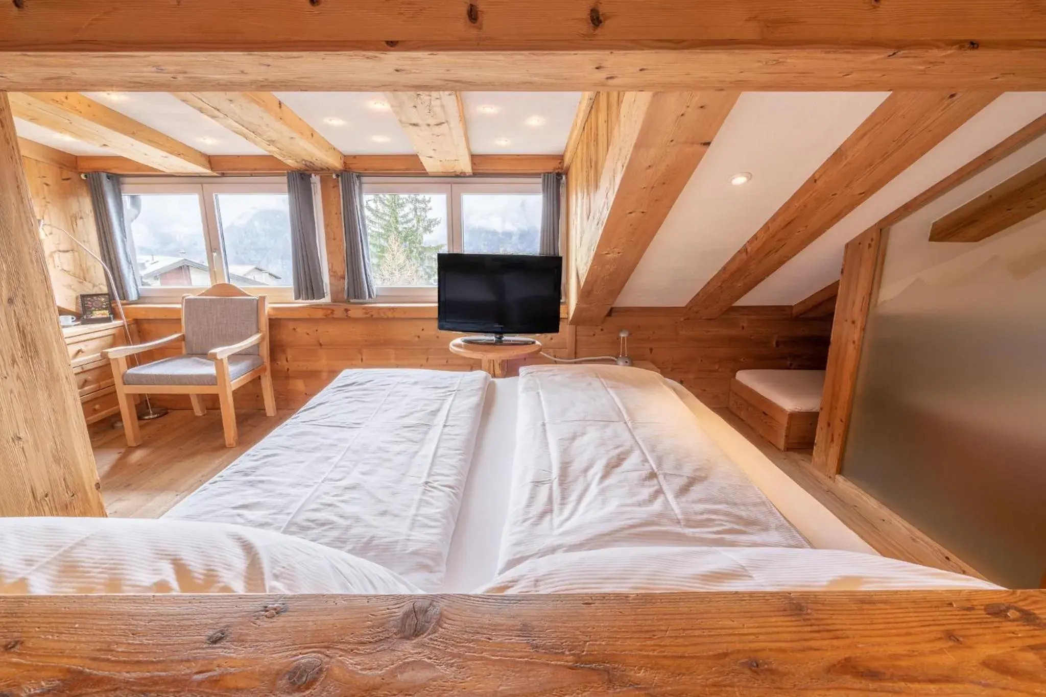 Bed in Lifestyle & Spa Hotel Grächerhof Bed in Lifestyle & Spa Hotel Grächerhof