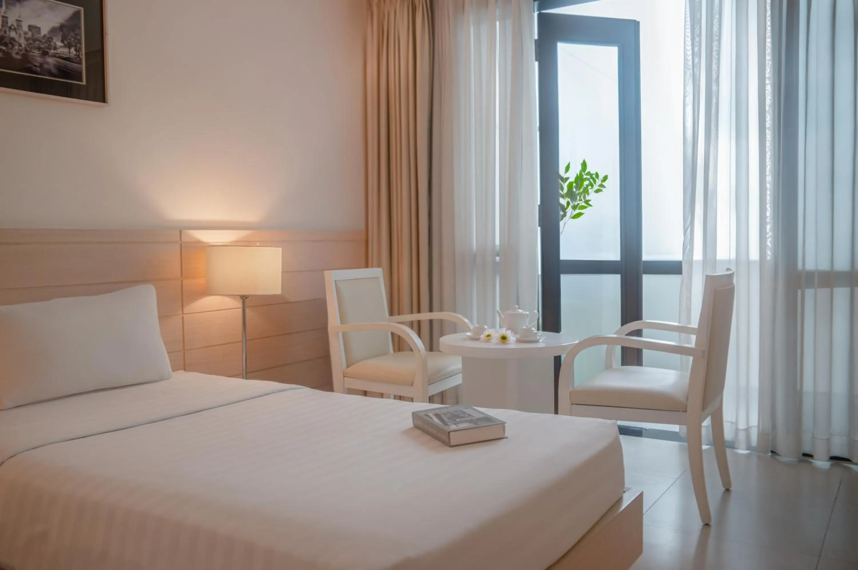 Seating area, Bed in Nhi Phi Hotel