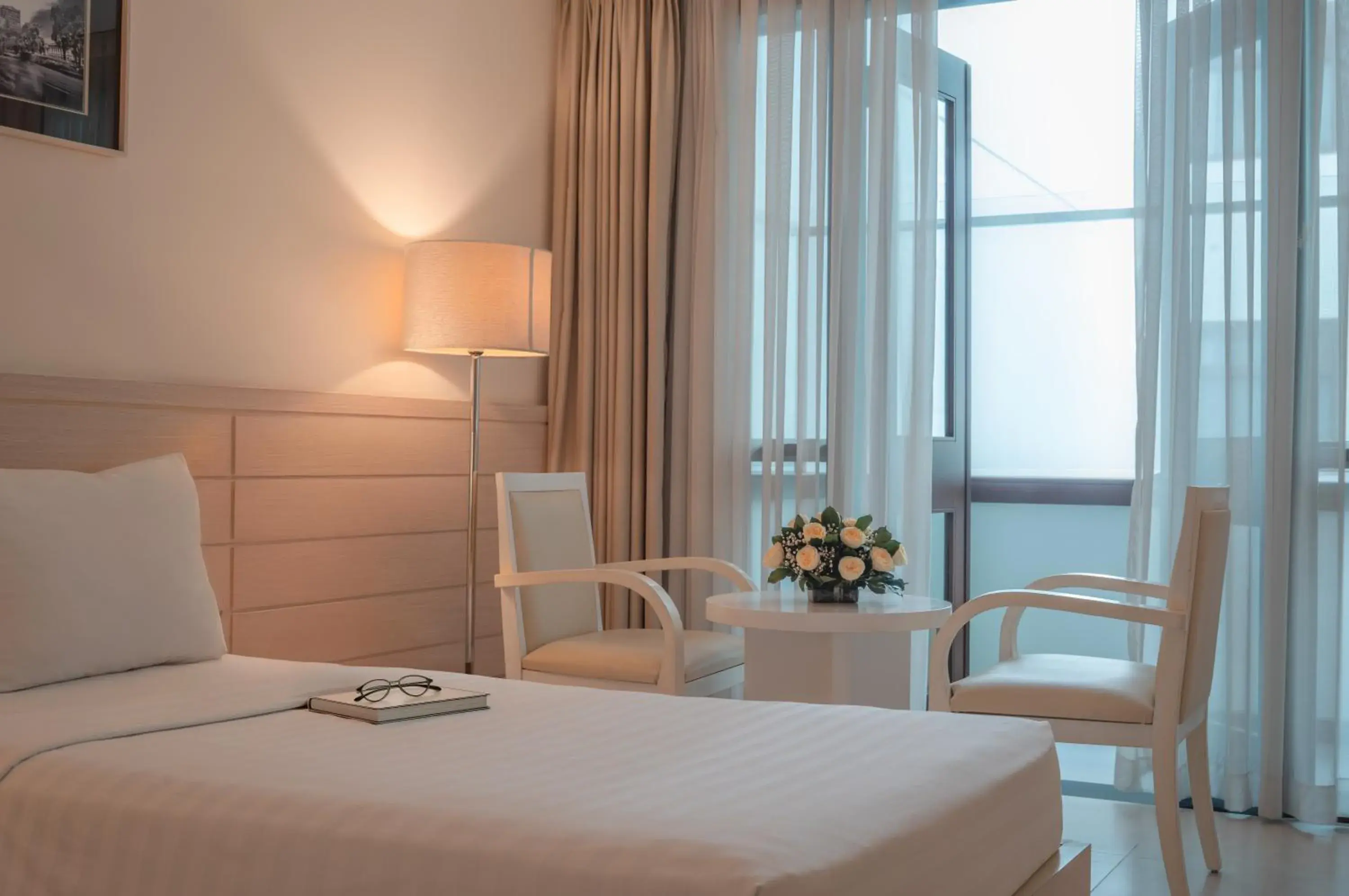 Seating area, Bed in Nhi Phi Hotel Seating area, Bed in Nhi Phi Hotel