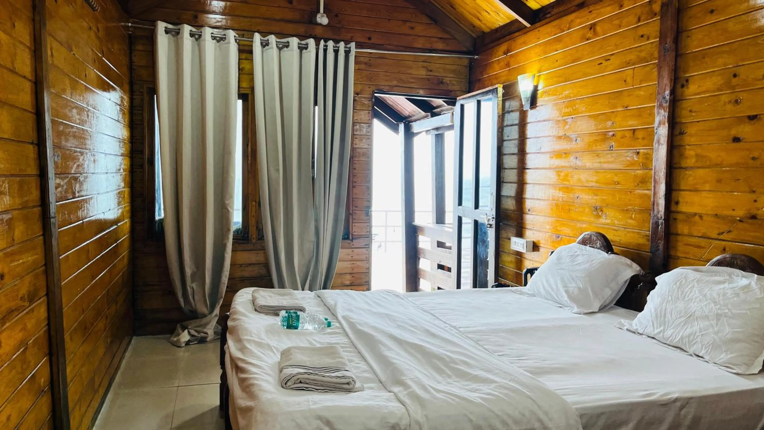 Bed in Palolem Luxuries Beach Cottages