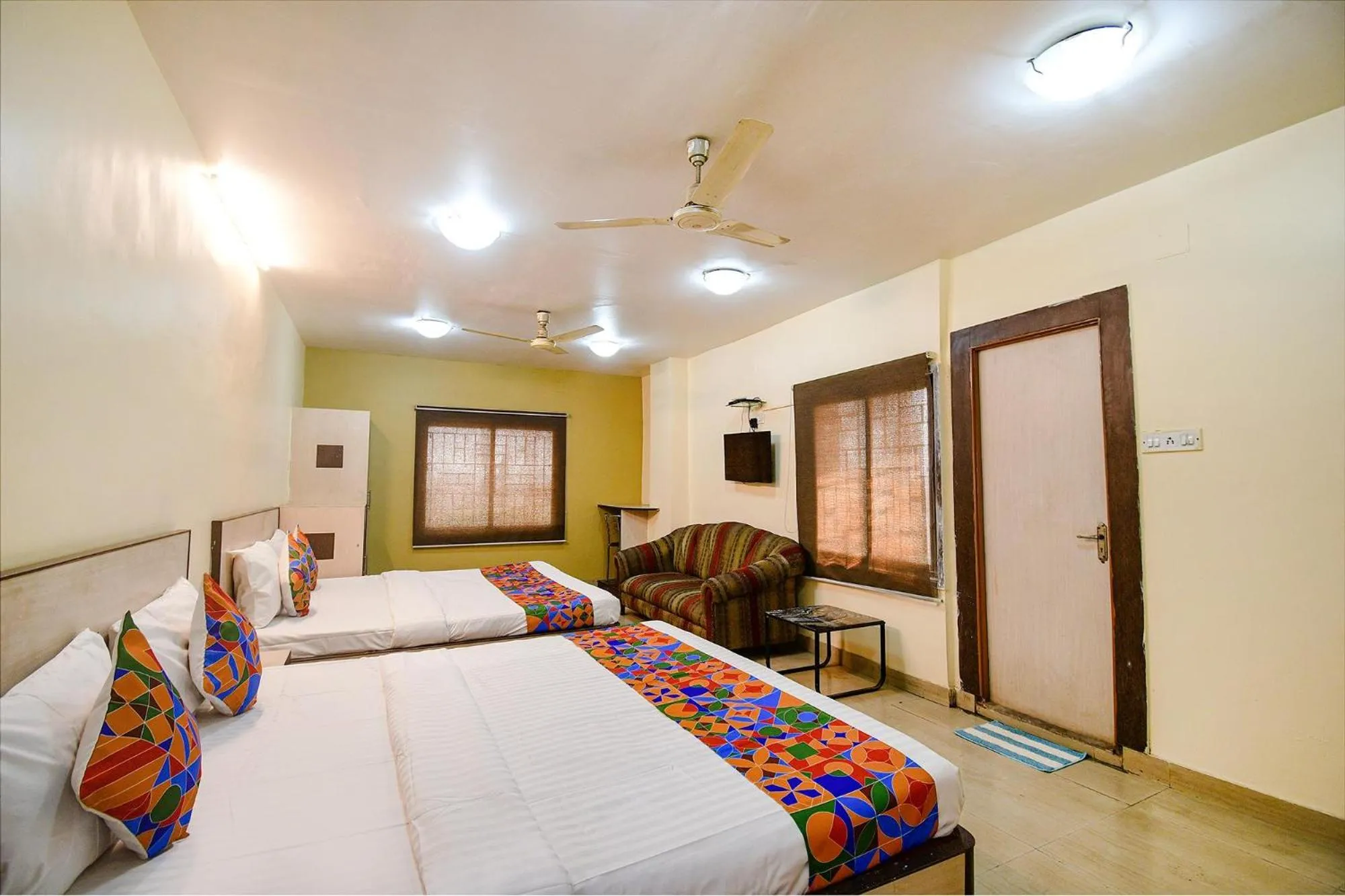 Bed in FabHotel Kamala Inn