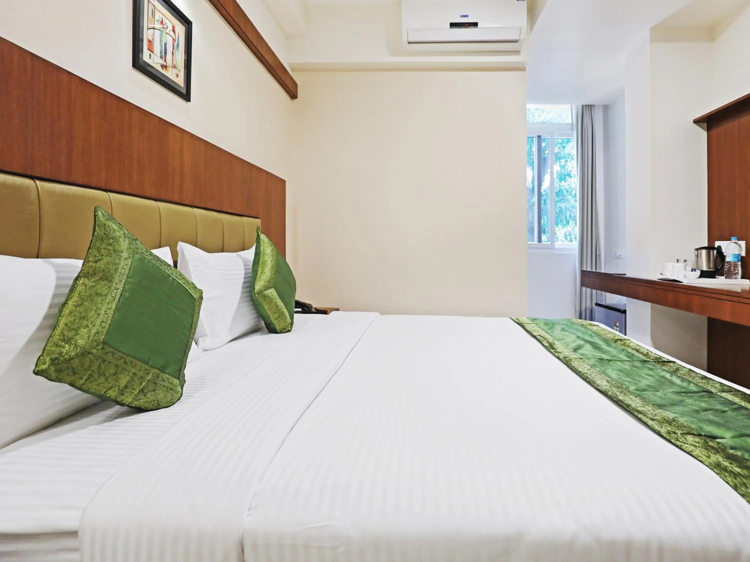 Bed in Treebo Akshaya Bull Temple