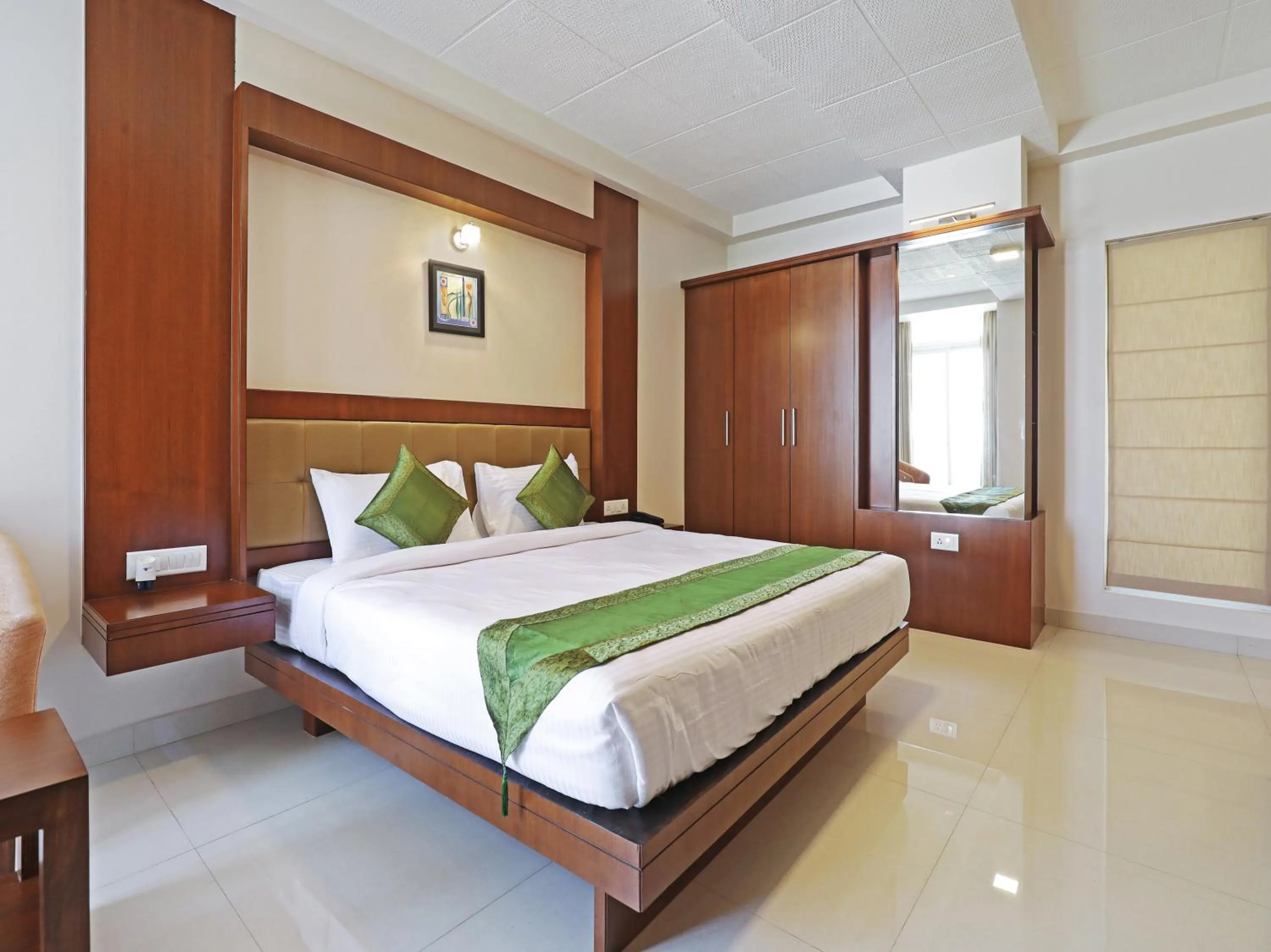 Bed in Treebo Akshaya Bull Temple