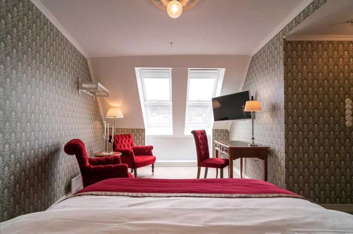 Photo of the whole room, Bed in Grand Hotel Flekkefjord