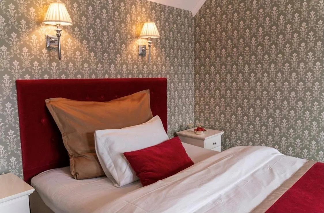 Bed in Grand Hotel Flekkefjord