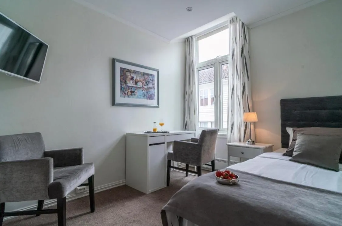 Photo of the whole room, Bed in Grand Hotel Flekkefjord