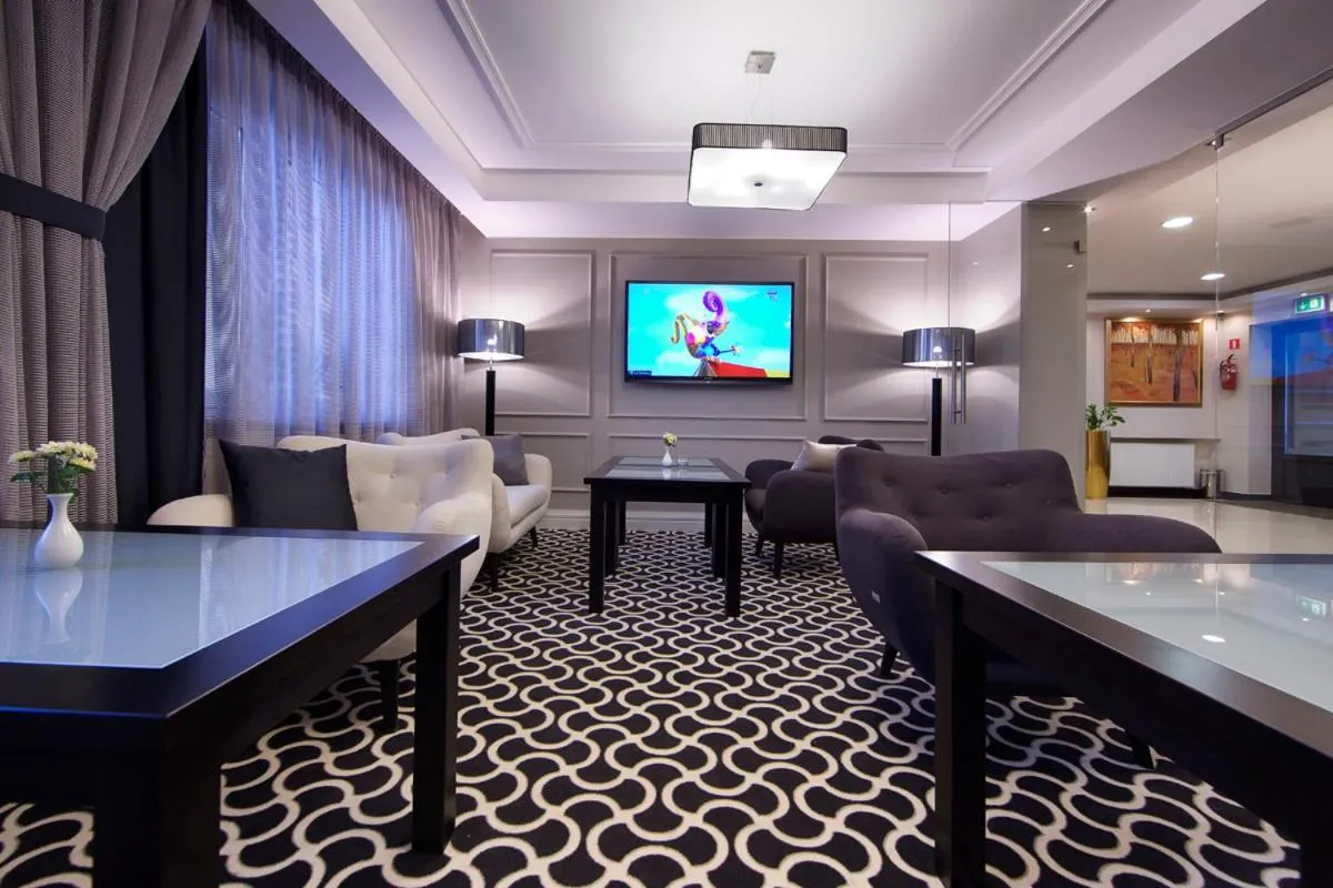 Communal lounge/ TV room in Miejsca noclegowe i Restauracja Kamiński