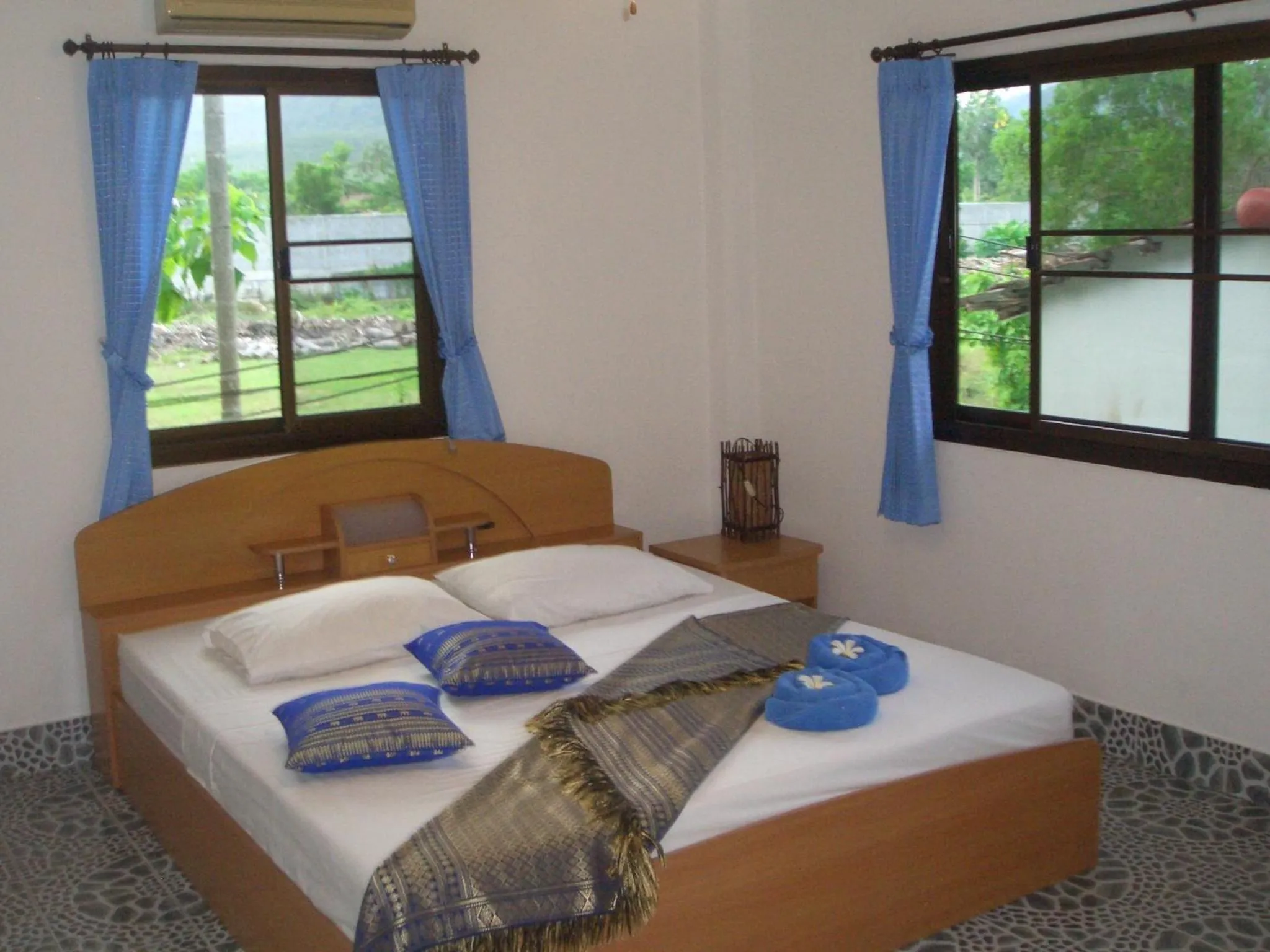 Bed in D&K Smiley Phuket Resort