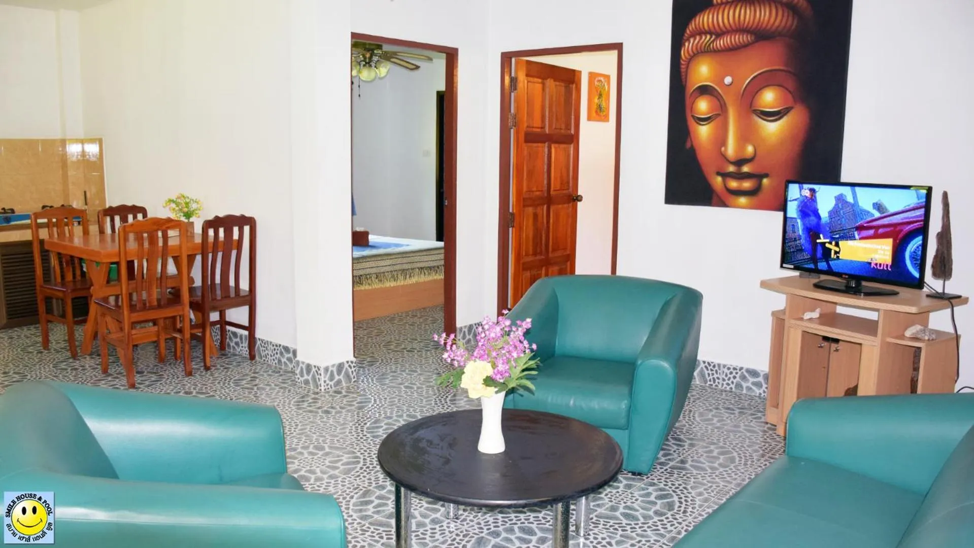 Communal lounge/ TV room in D&K Smiley Phuket Resort