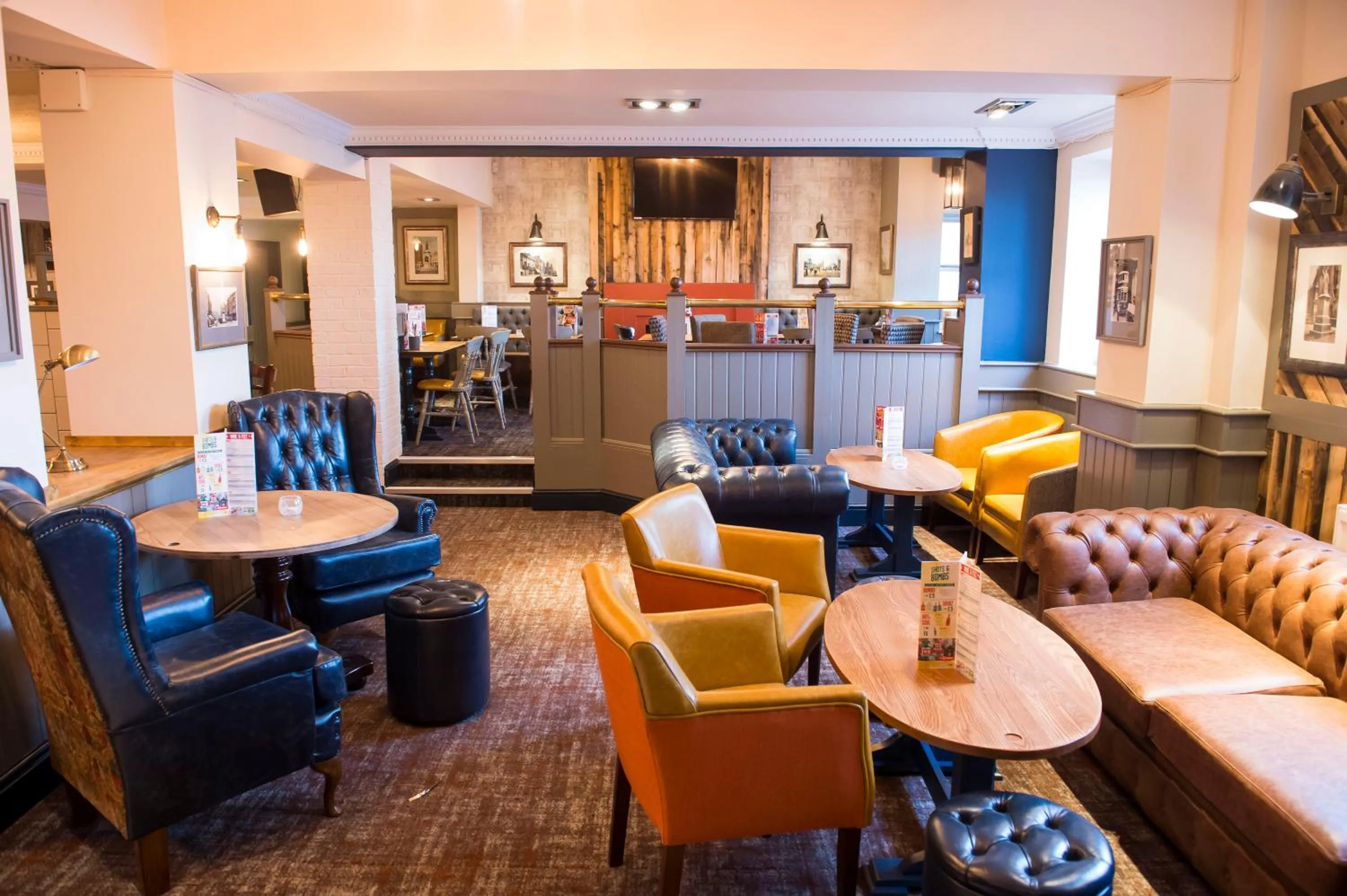 Seating area in Old Grey Mare Inn by Greene King Inns