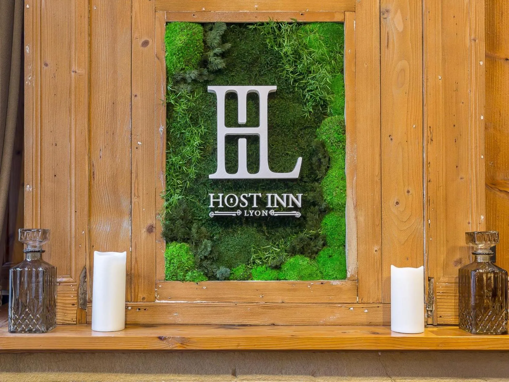 Property logo or sign in Host Inn Nifty Sūite