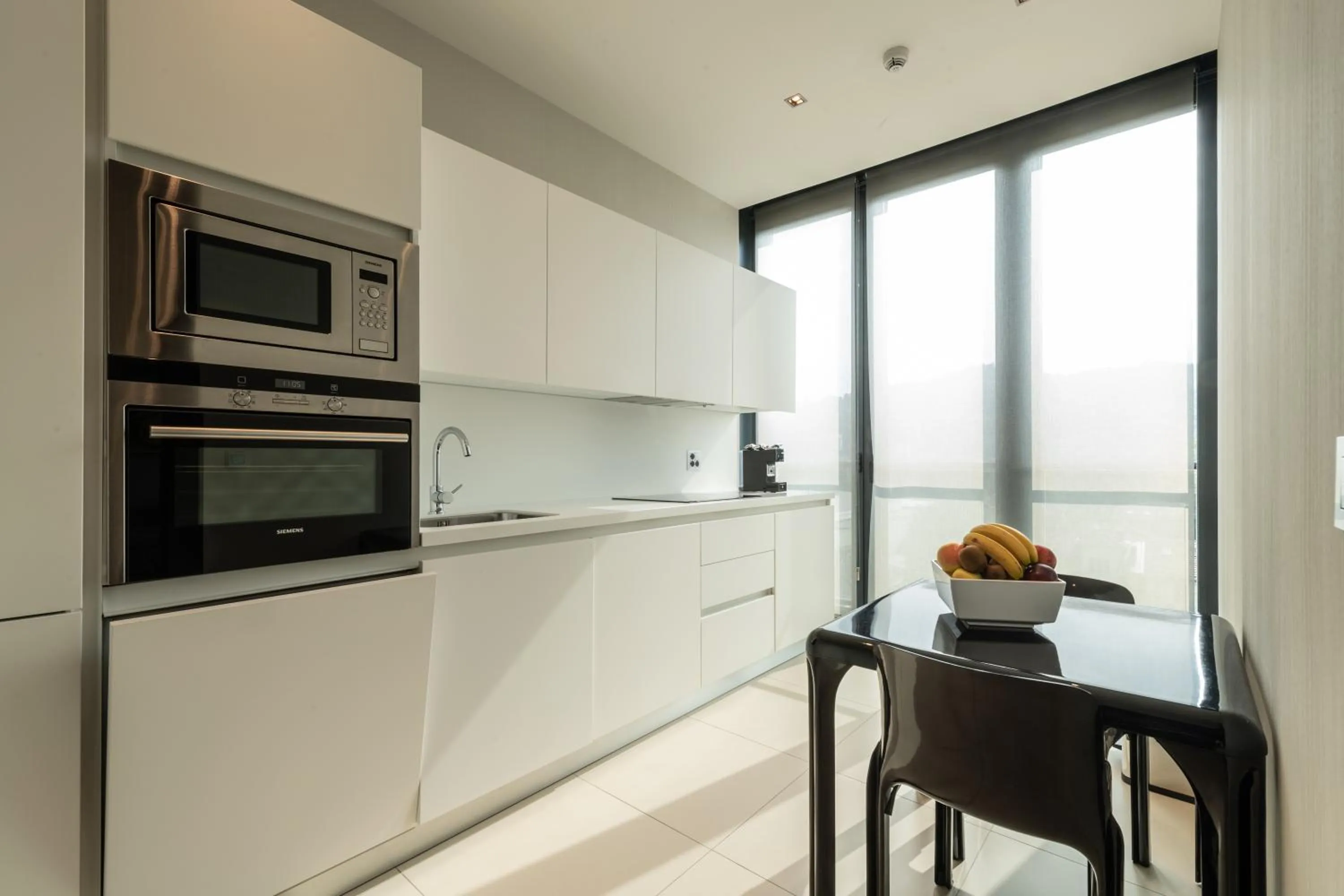 Kitchen or kitchenette in DUPARC Contemporary Suites