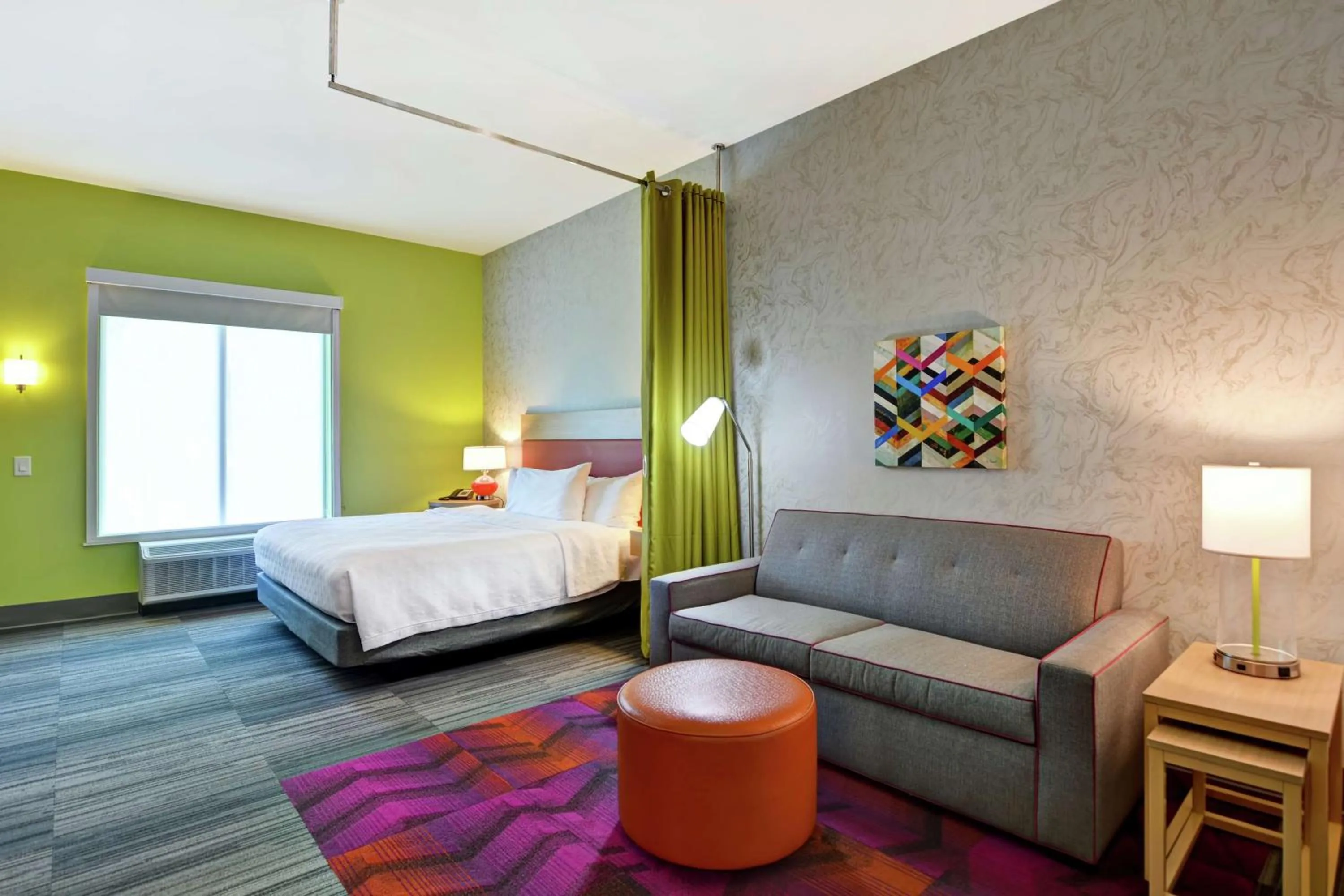 Living room, Bed in Home2 Suites Charleston West Ashley