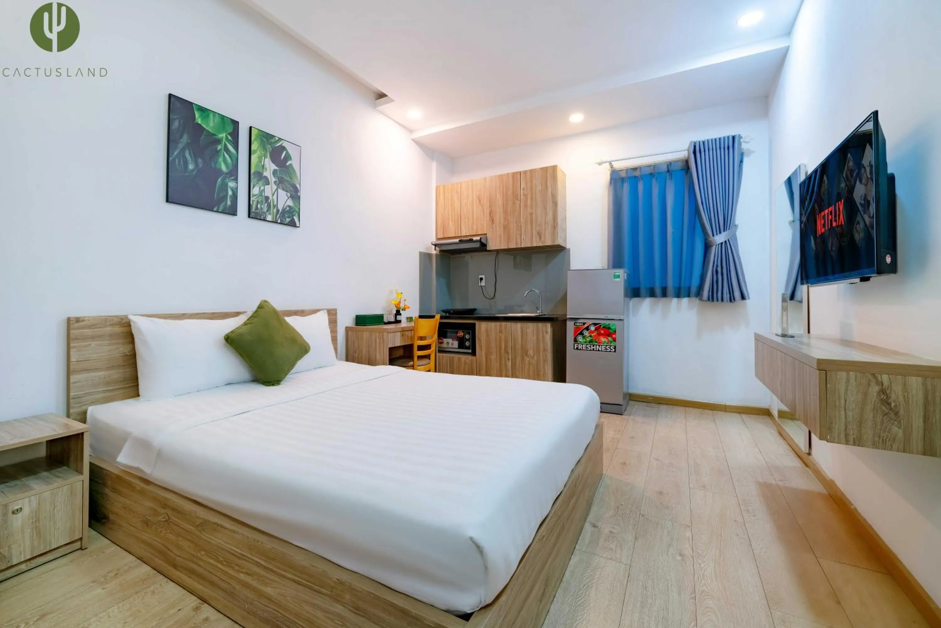 Kitchen or kitchenette, Bed in Cactusland Hotel & Apartment