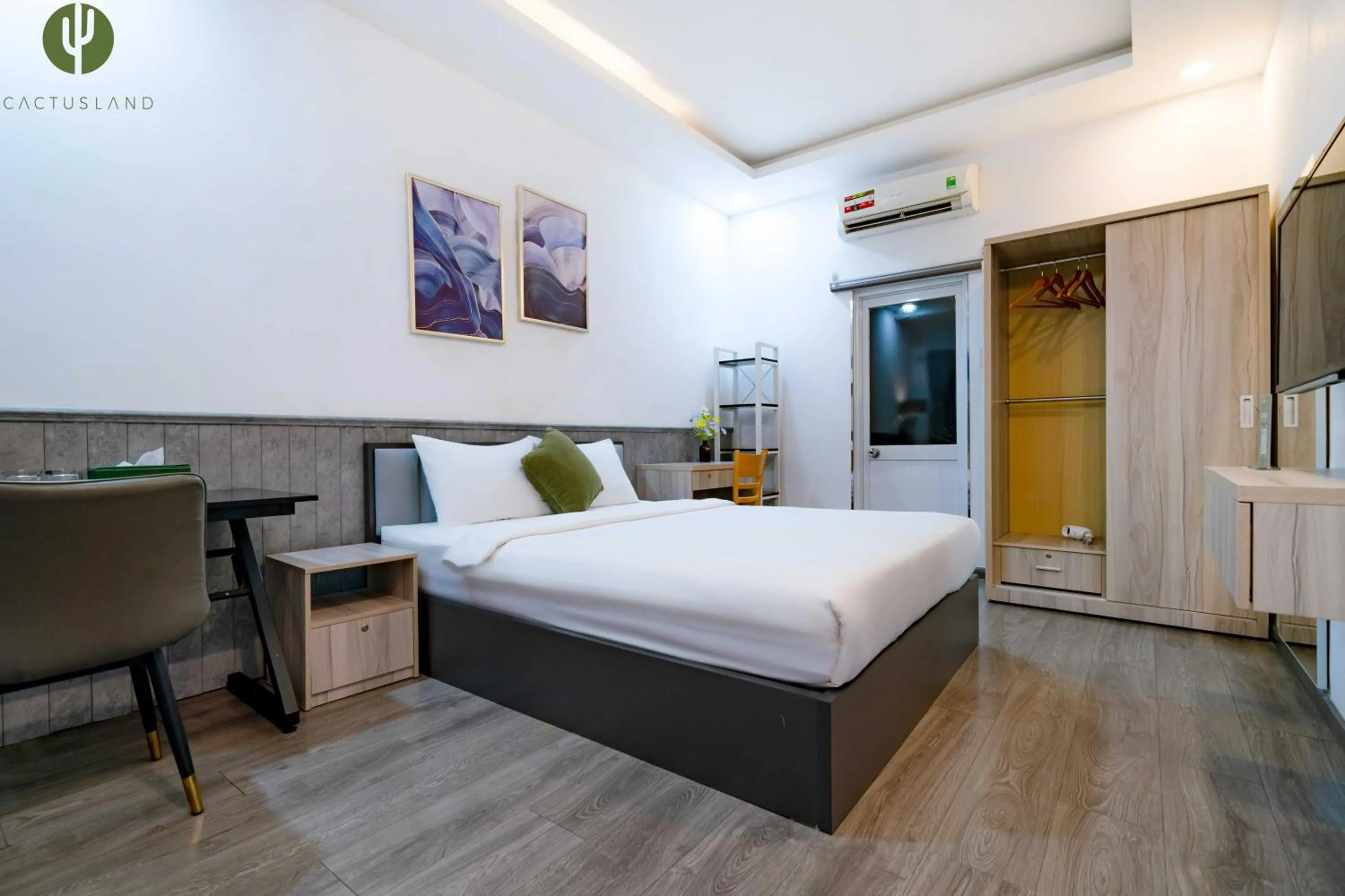 Bed in Cactusland Hotel & Apartment