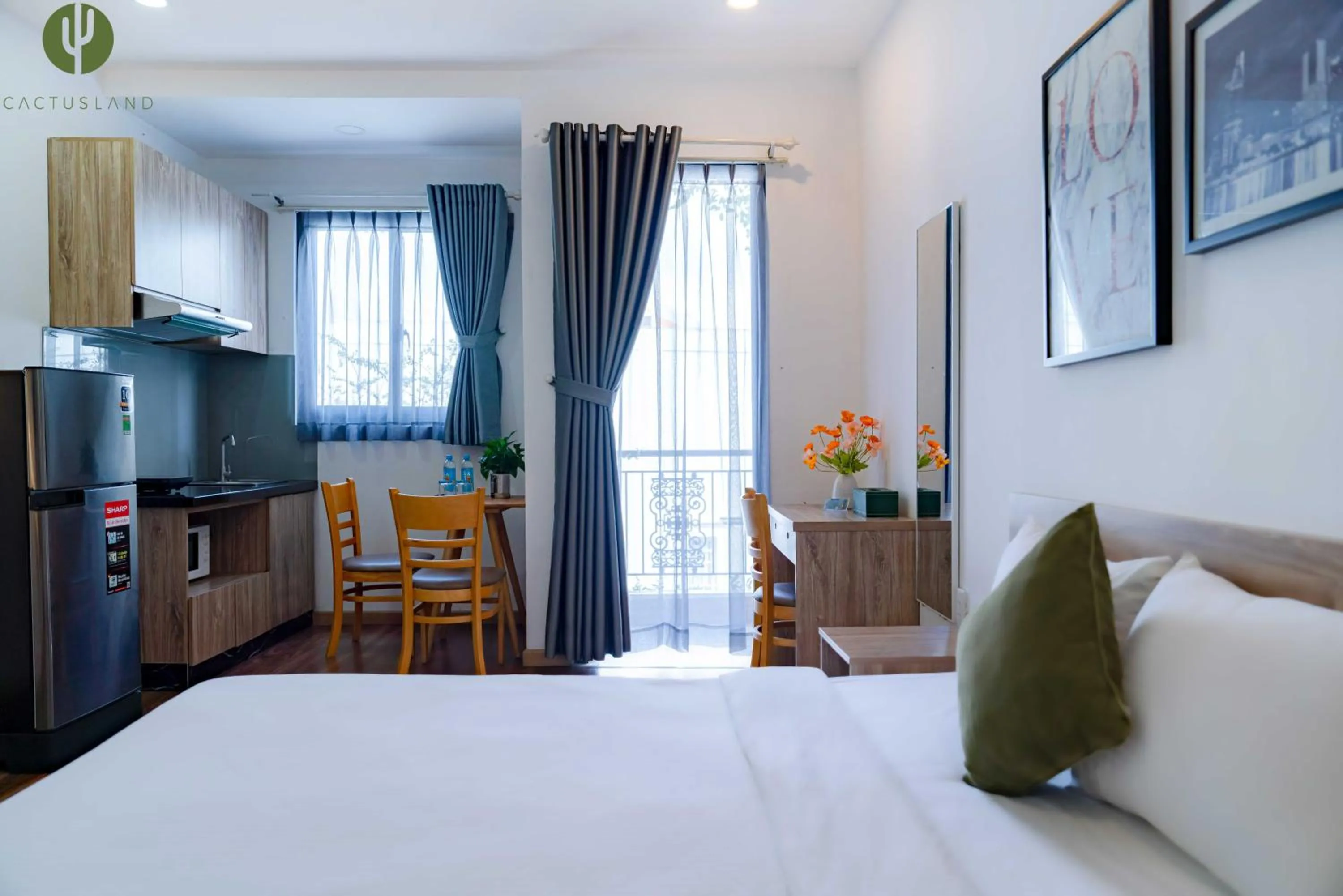 Bed in Cactusland Hotel & Apartment