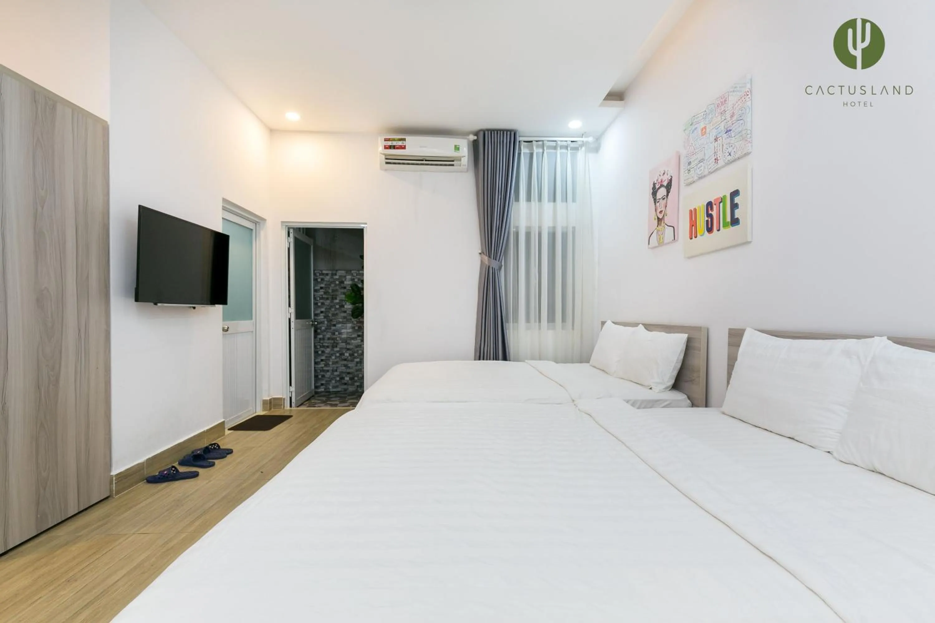 Bed in Cactusland Hotel & Apartment