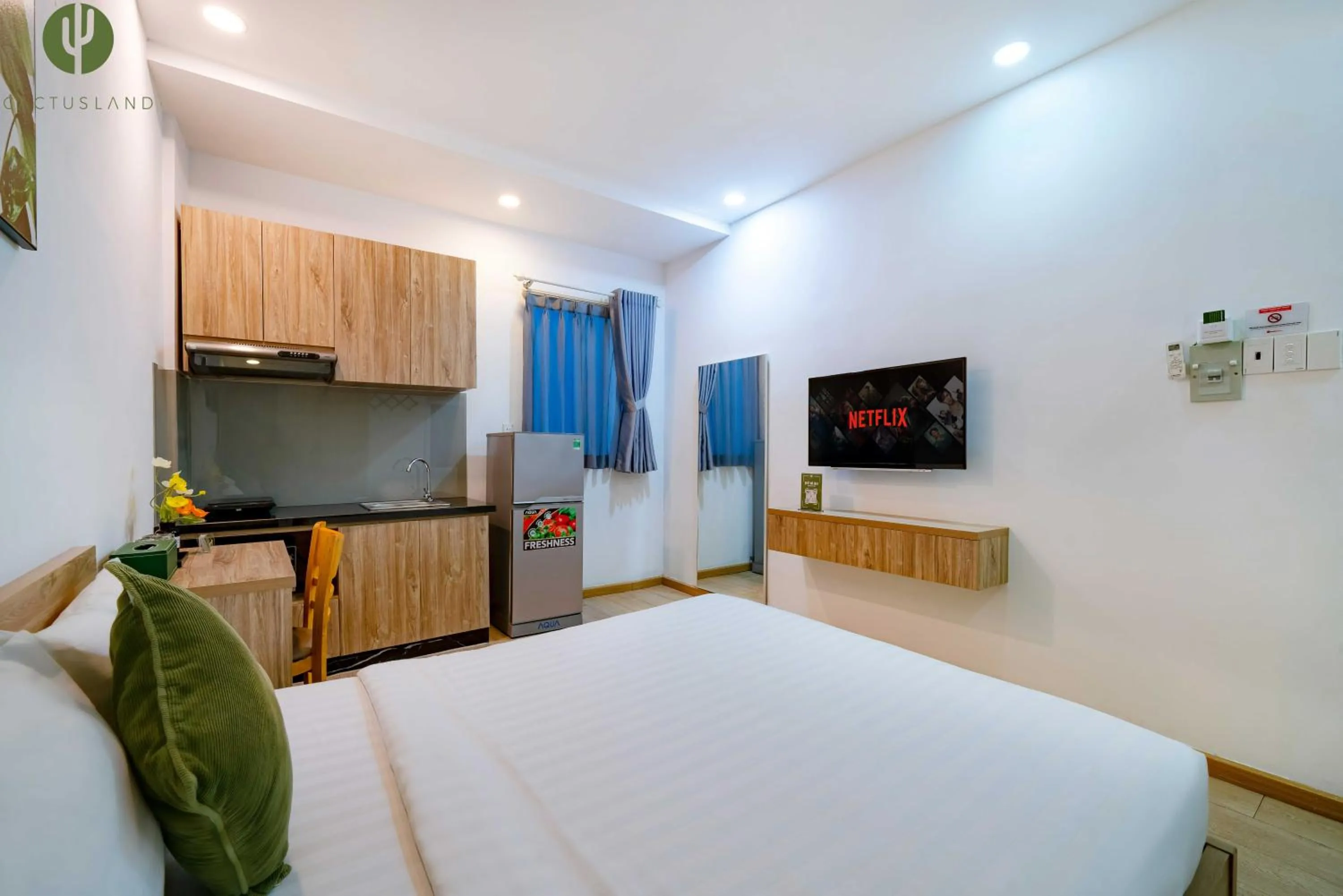 Bed in Cactusland Hotel & Apartment