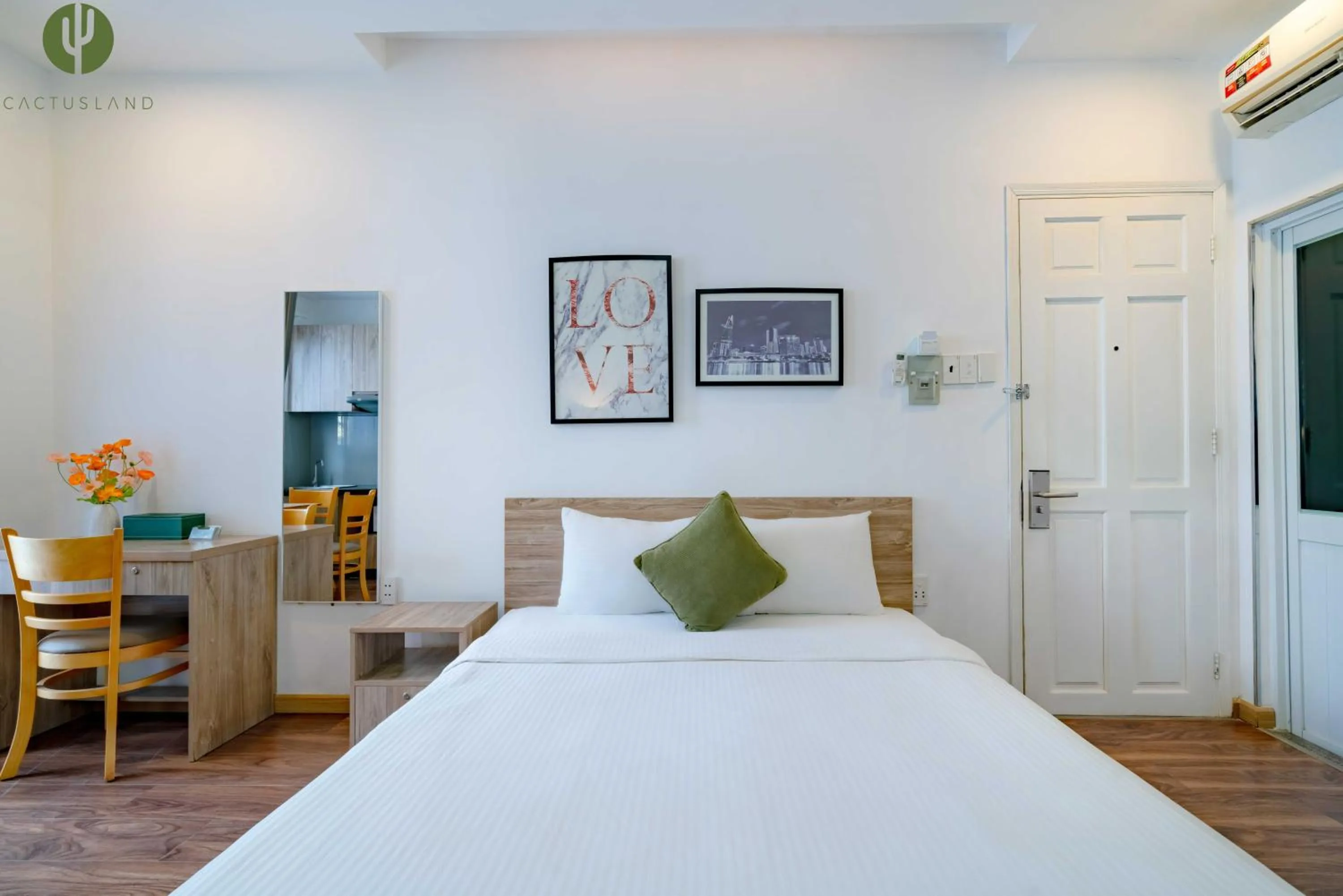 Bed in Cactusland Hotel & Apartment