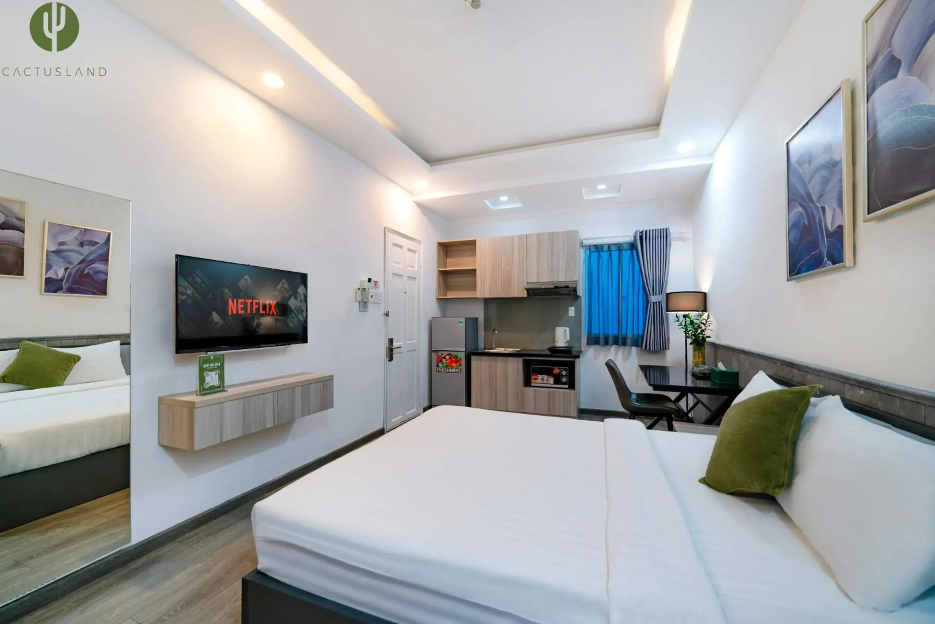 Communal lounge/ TV room, Bed in Cactusland Hotel & Apartment Communal lounge/ TV room, Bed in Cactusland Hotel & Apartment