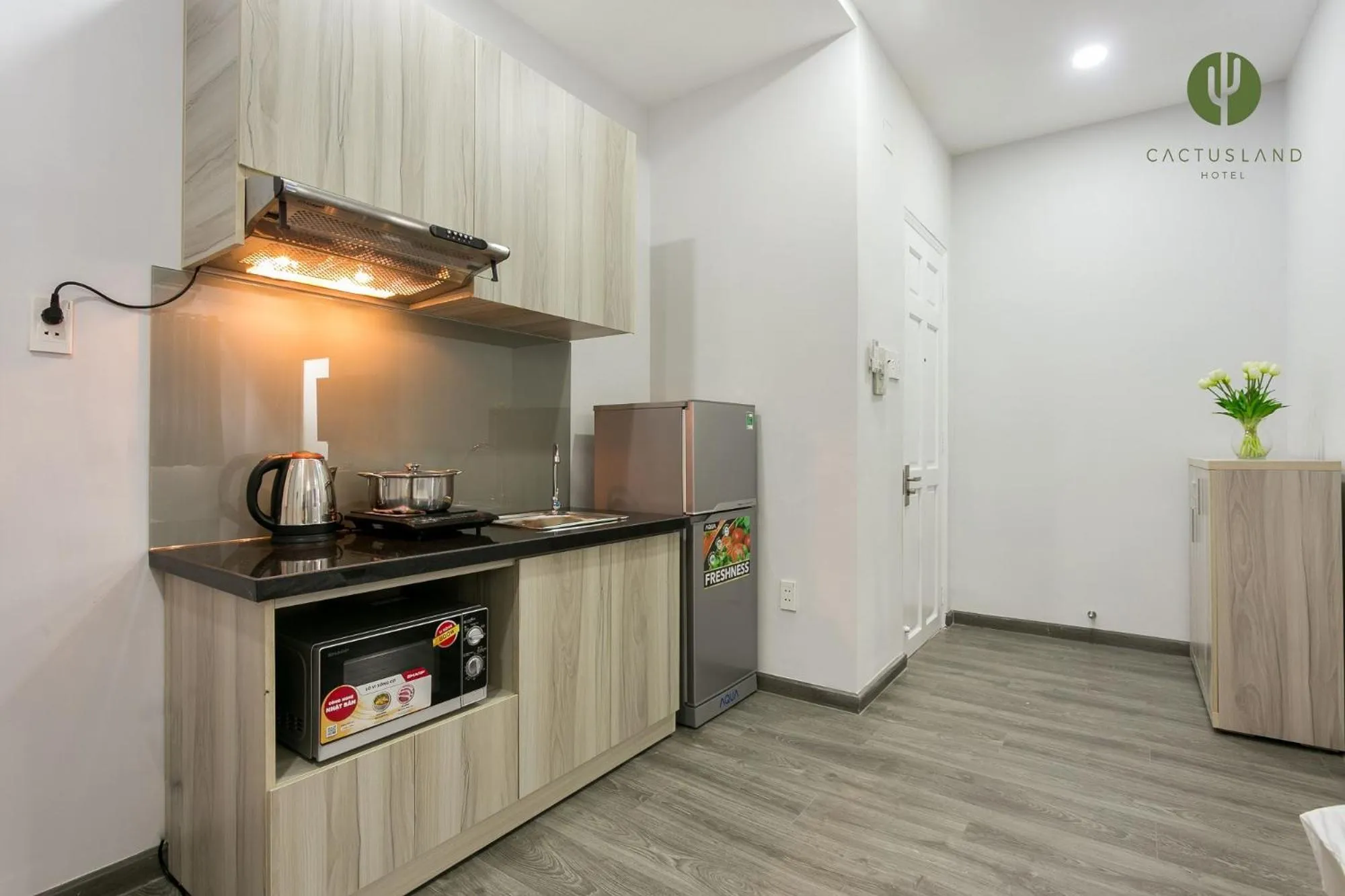 Kitchen or kitchenette in Cactusland Hotel & Apartment