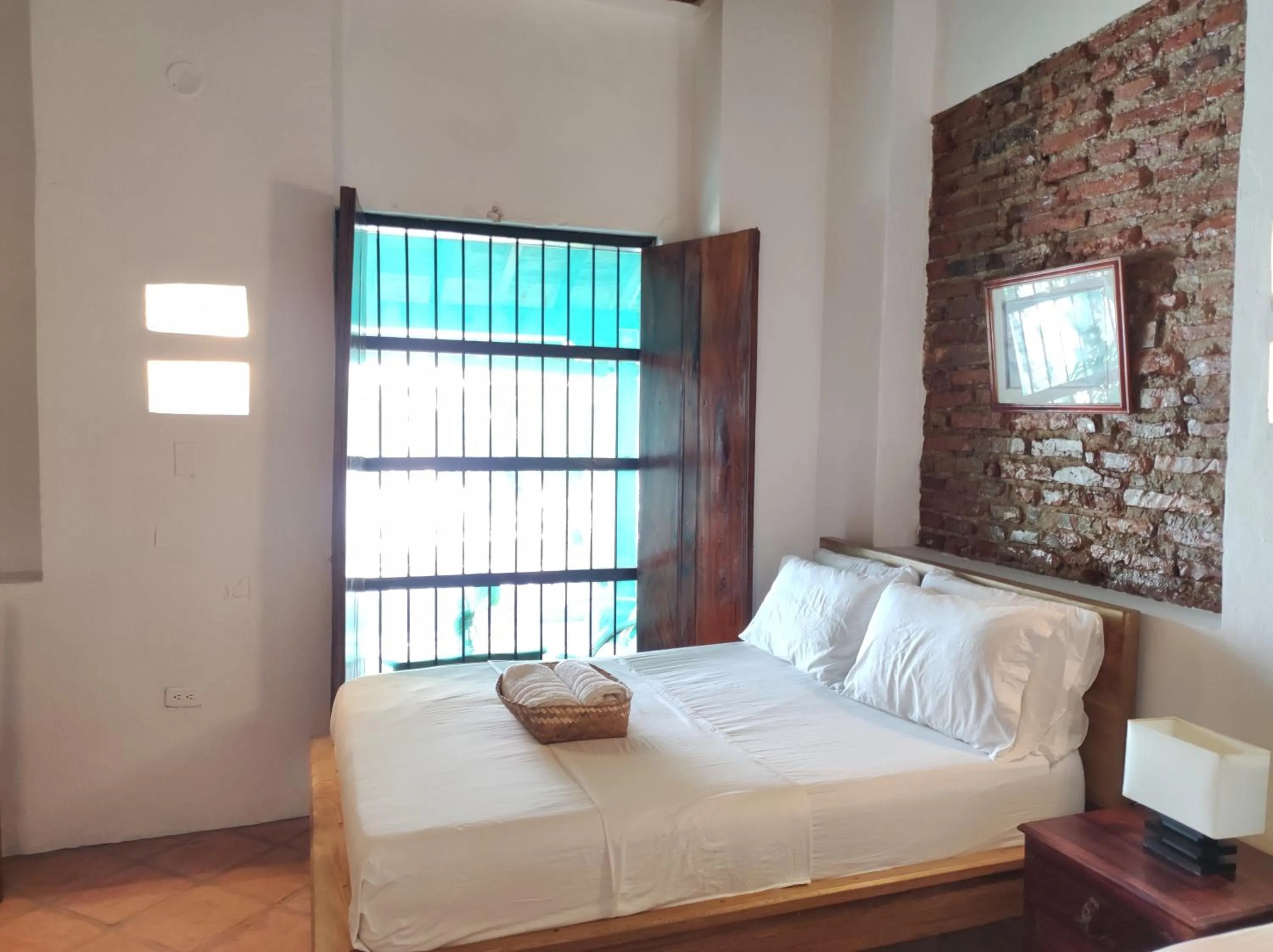 Bed in HOTEL NIETO MOMPOX, ubicado en el corazón del centro histórico, frente al rio magdalena en zona de malecón