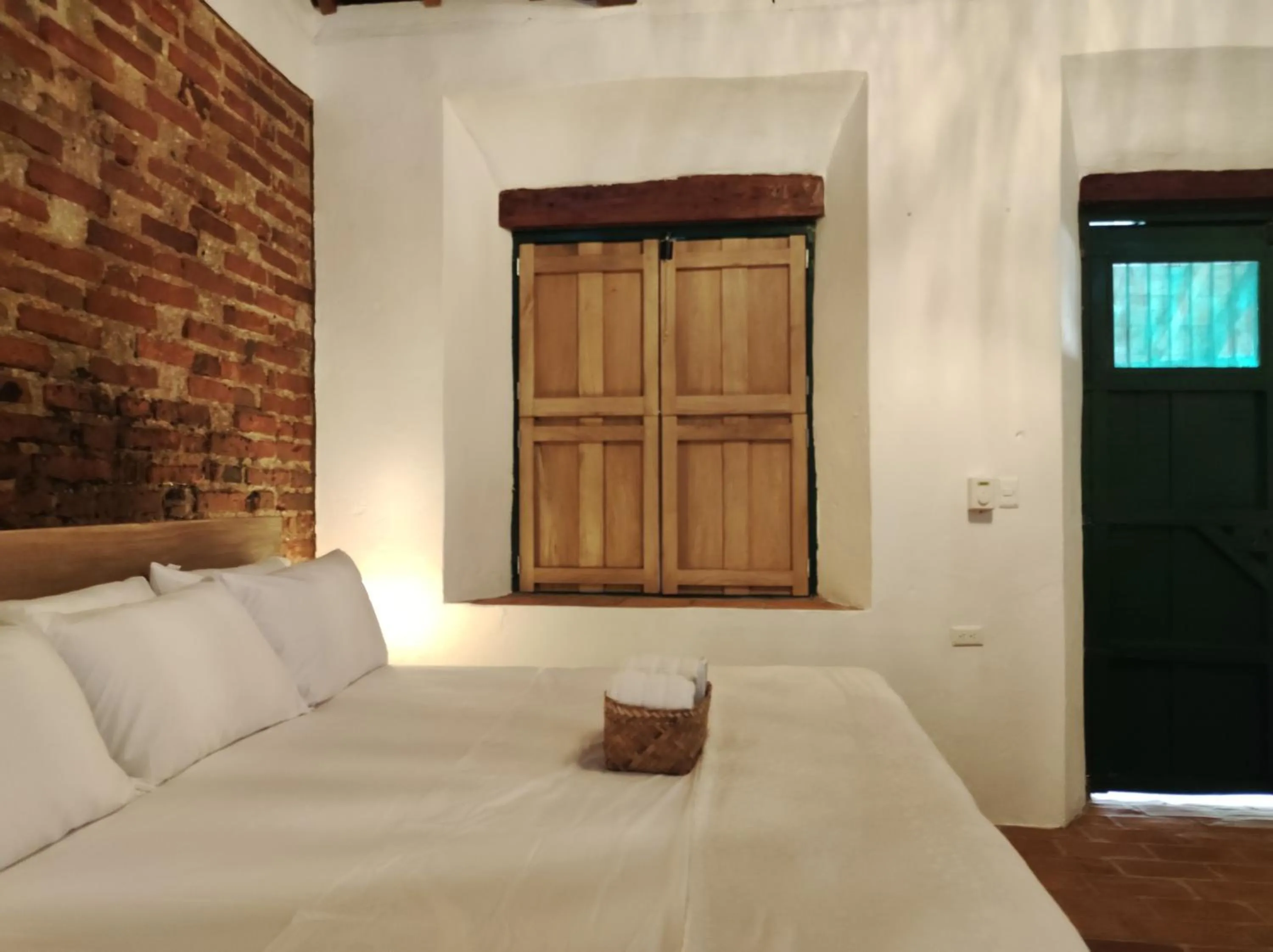 Bed in HOTEL NIETO MOMPOX, ubicado en el corazón del centro histórico, frente al rio magdalena en zona de malecón
