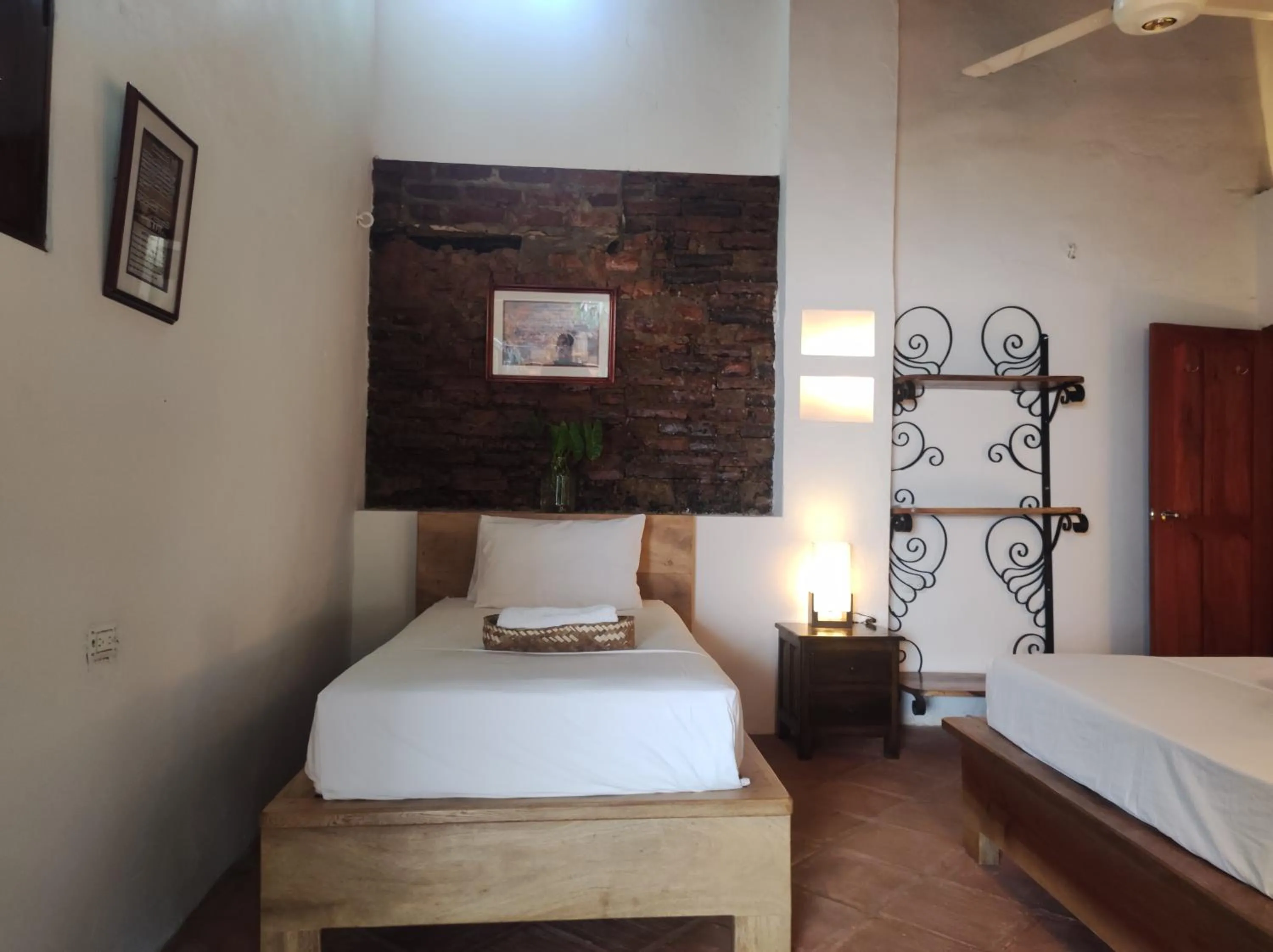 Bed in HOTEL NIETO MOMPOX, ubicado en el corazón del centro histórico, frente al rio magdalena en zona de malecón