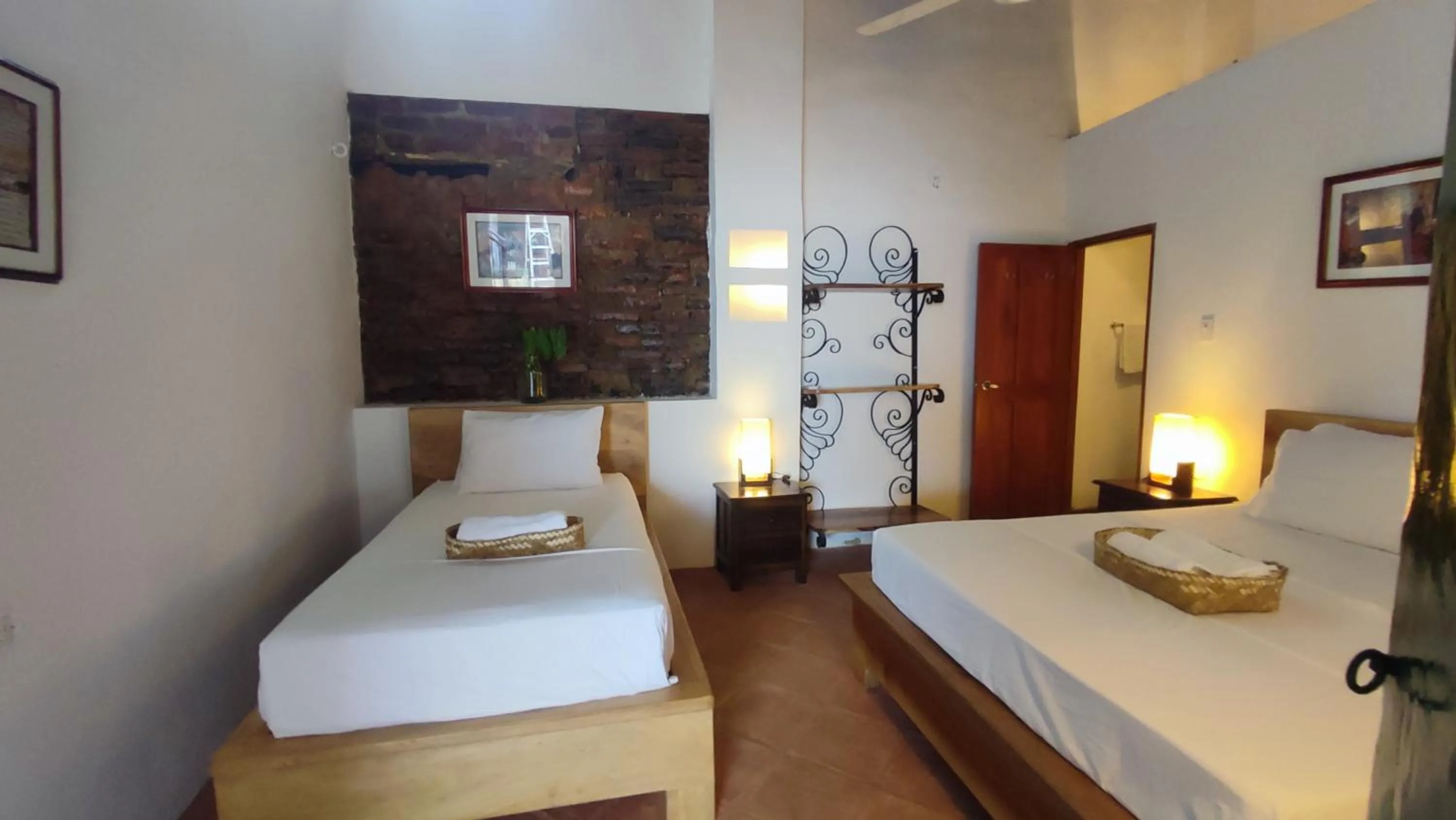 Bed in HOTEL NIETO MOMPOX, ubicado en el corazón del centro histórico, frente al rio magdalena en zona de malecón