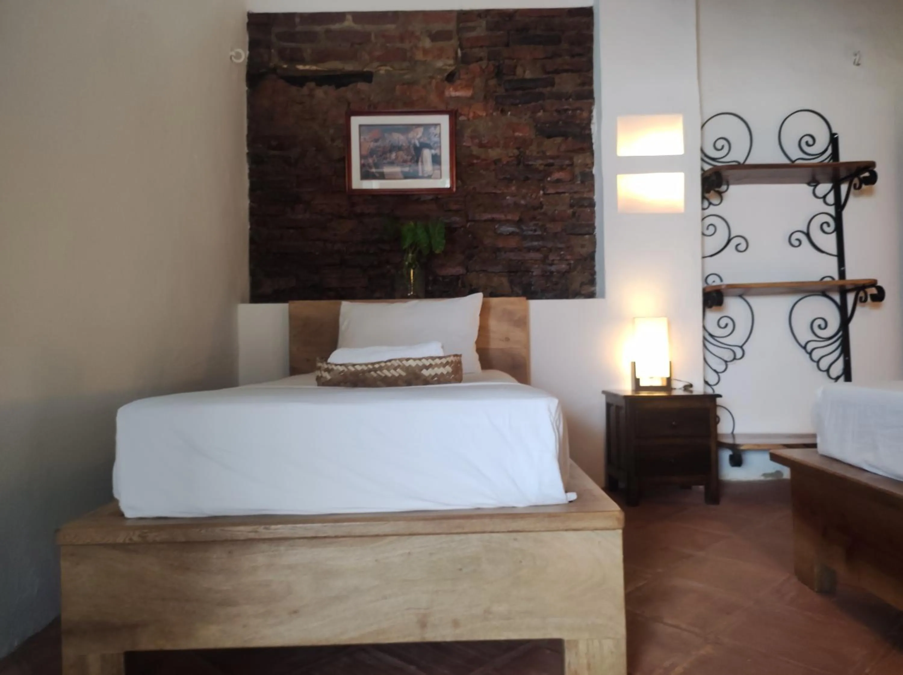 Bed in HOTEL NIETO MOMPOX, ubicado en el corazón del centro histórico, frente al rio magdalena en zona de malecón