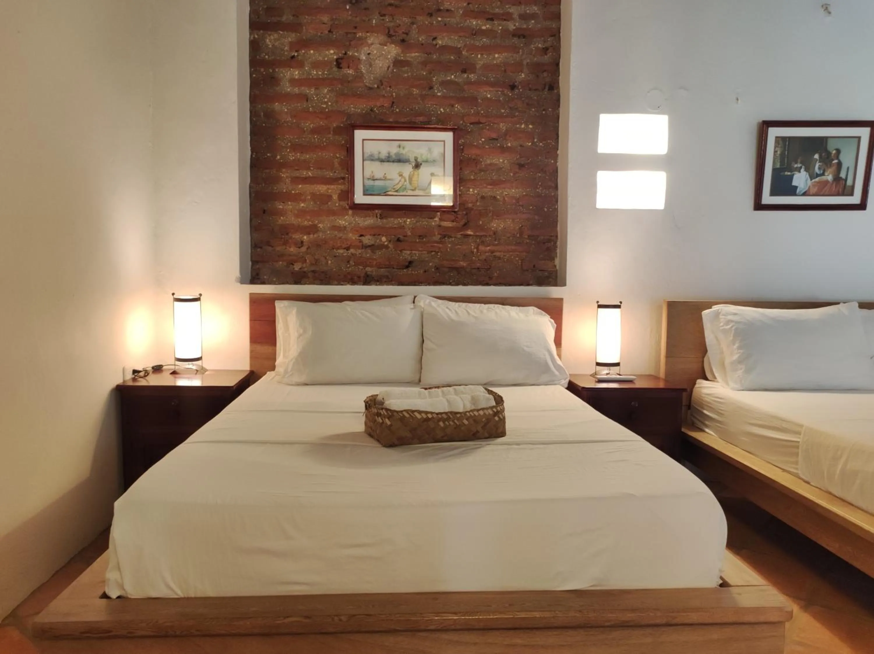 Bed in HOTEL NIETO MOMPOX, ubicado en el corazón del centro histórico, frente al rio magdalena en zona de malecón