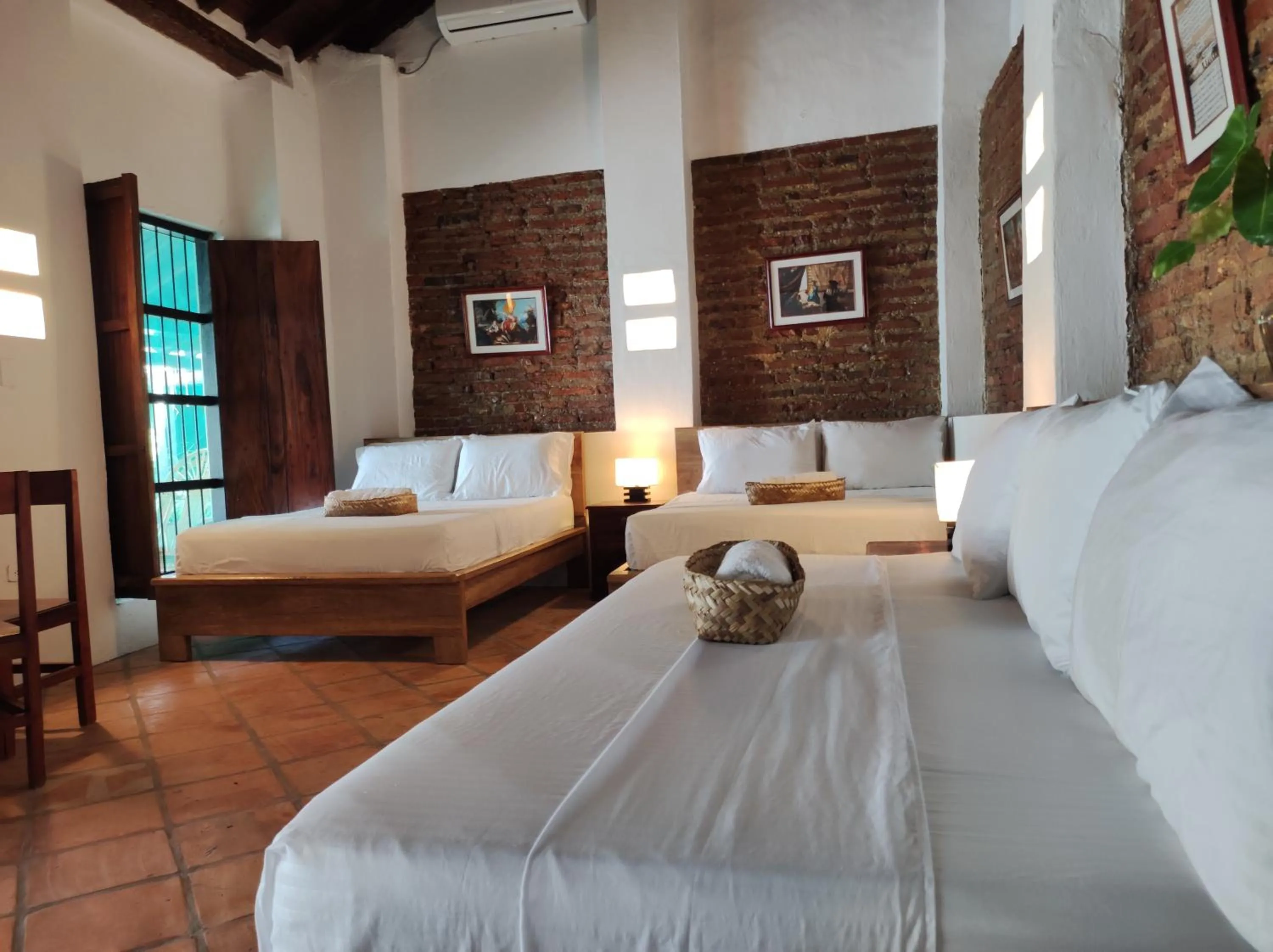 Bed in HOTEL NIETO MOMPOX, ubicado en el corazón del centro histórico, frente al rio magdalena en zona de malecón