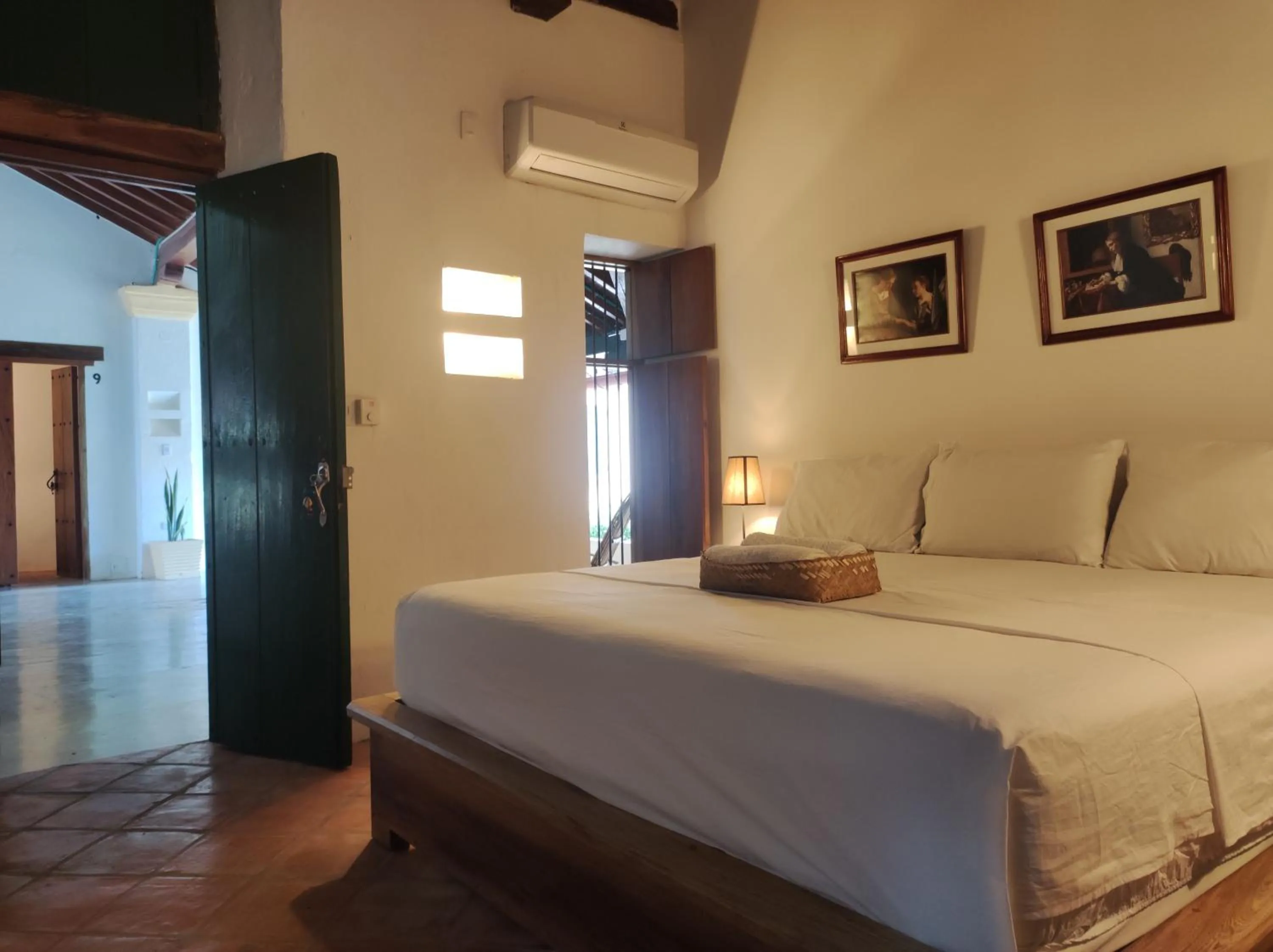 Bed in HOTEL NIETO MOMPOX, ubicado en el corazón del centro histórico, frente al rio magdalena en zona de malecón