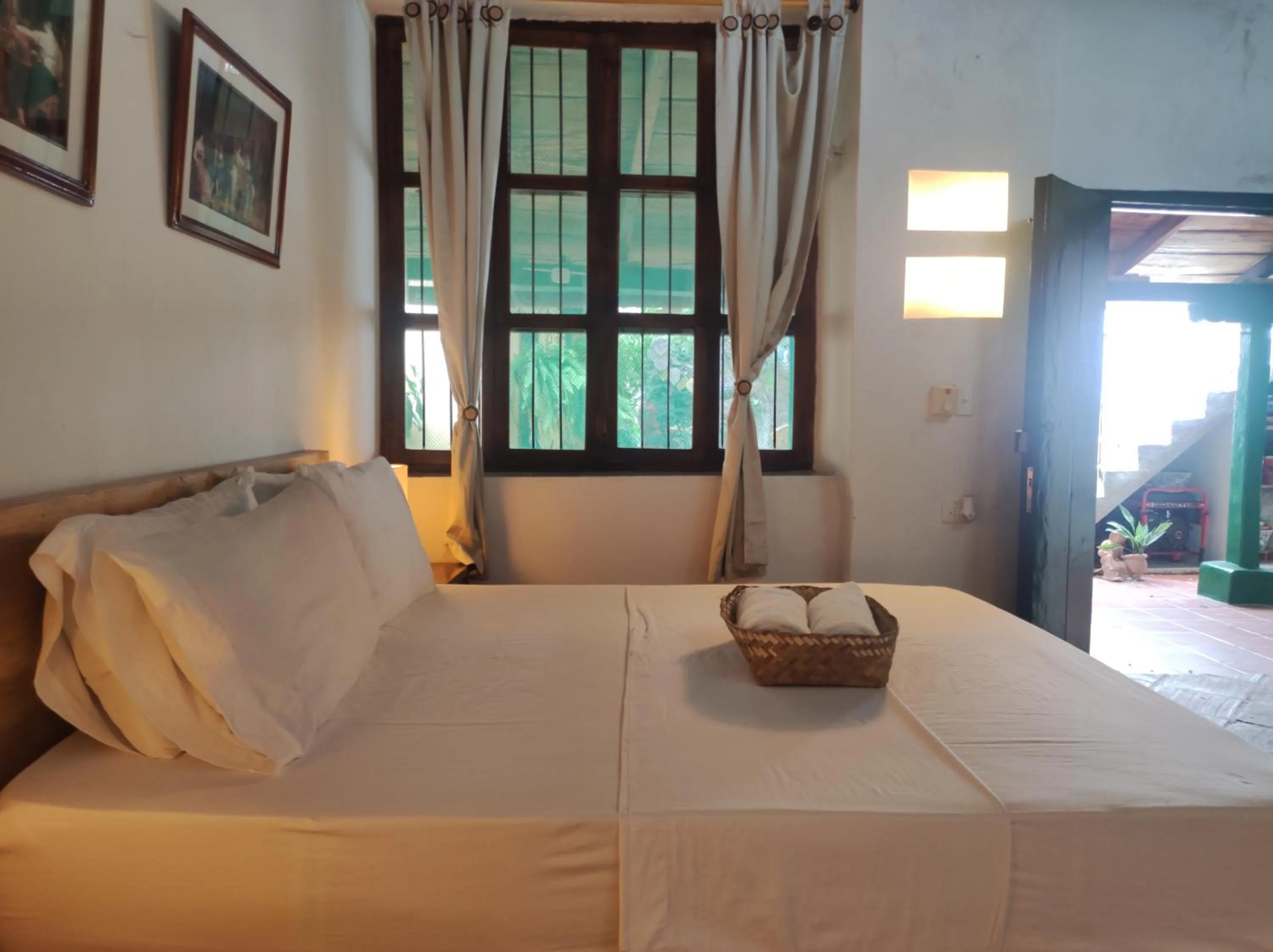 Bed in HOTEL NIETO MOMPOX, ubicado en el corazón del centro histórico, frente al rio magdalena en zona de malecón