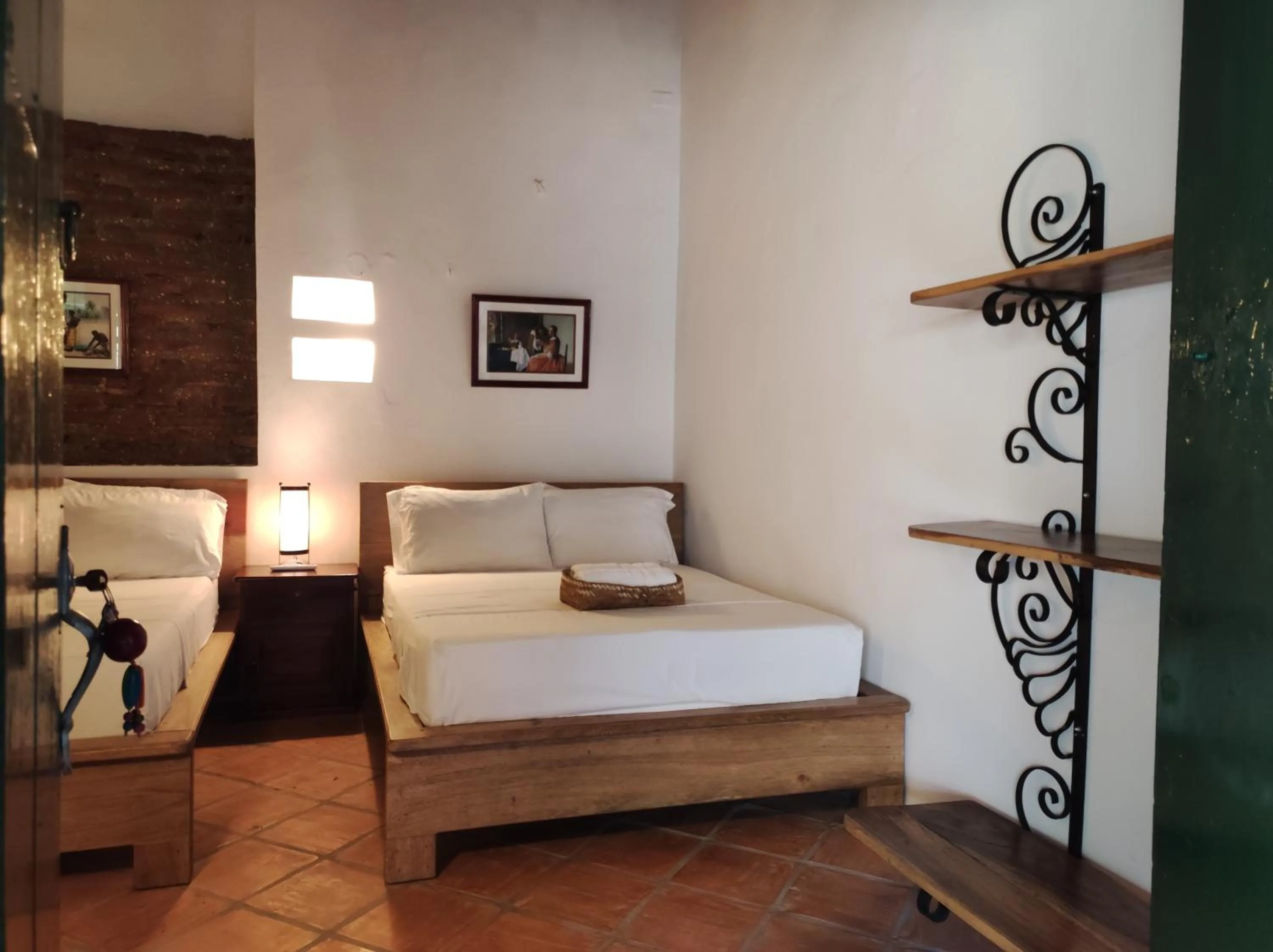 Bed in HOTEL NIETO MOMPOX, ubicado en el corazón del centro histórico, frente al rio magdalena en zona de malecón