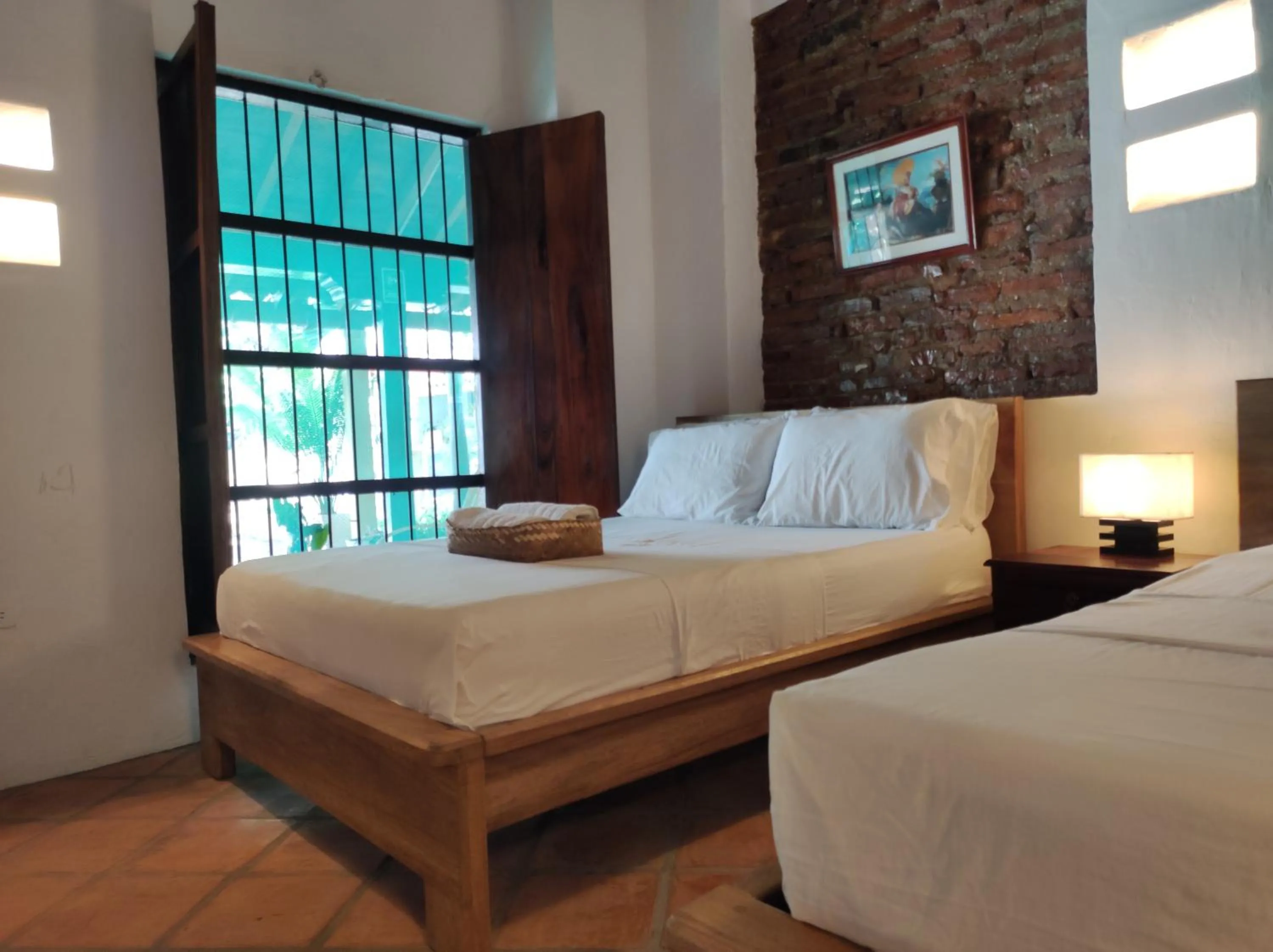 Bed in HOTEL NIETO MOMPOX, ubicado en el corazón del centro histórico, frente al rio magdalena en zona de malecón