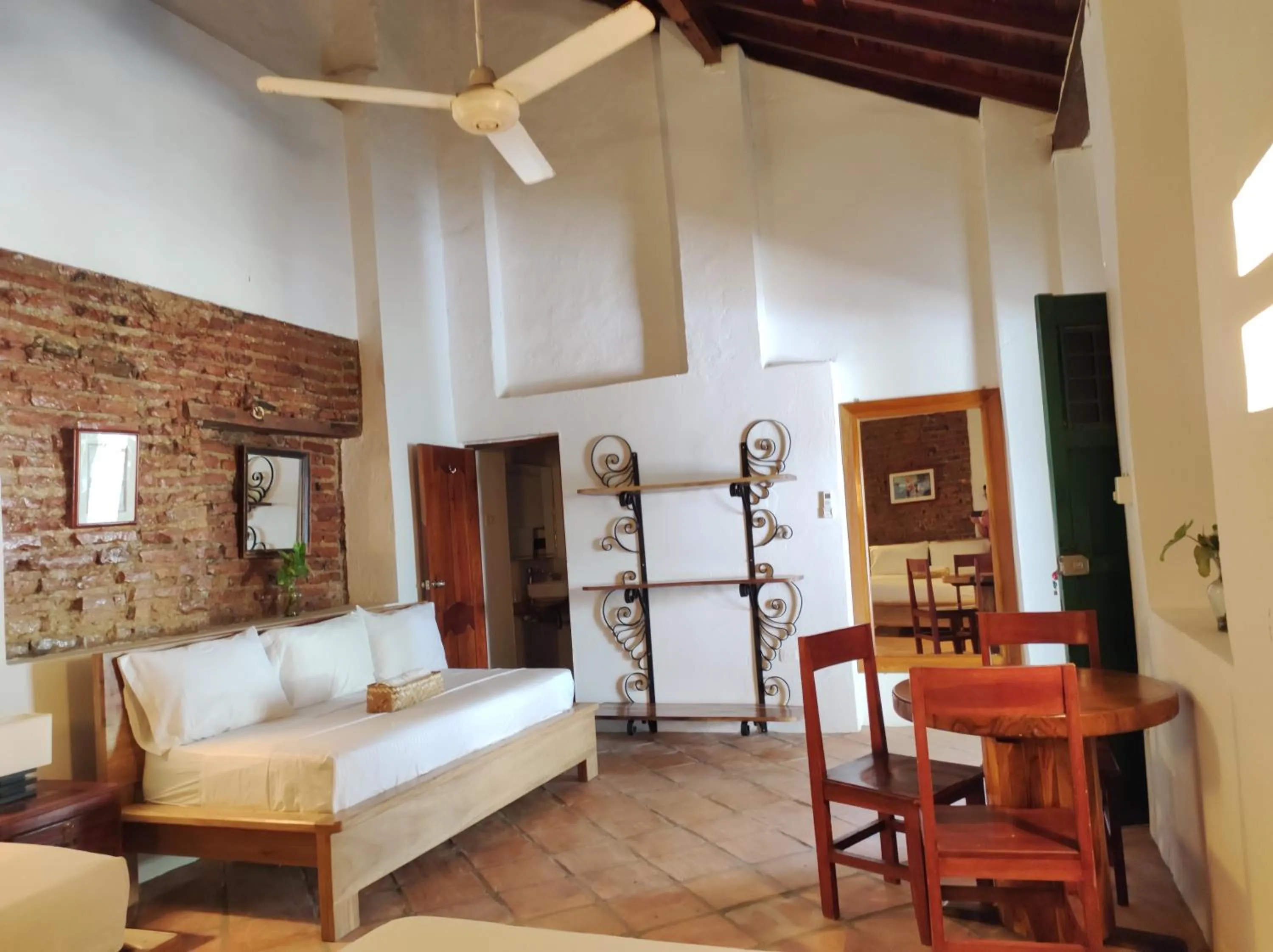 Bed in HOTEL NIETO MOMPOX, ubicado en el corazón del centro histórico, frente al rio magdalena en zona de malecón
