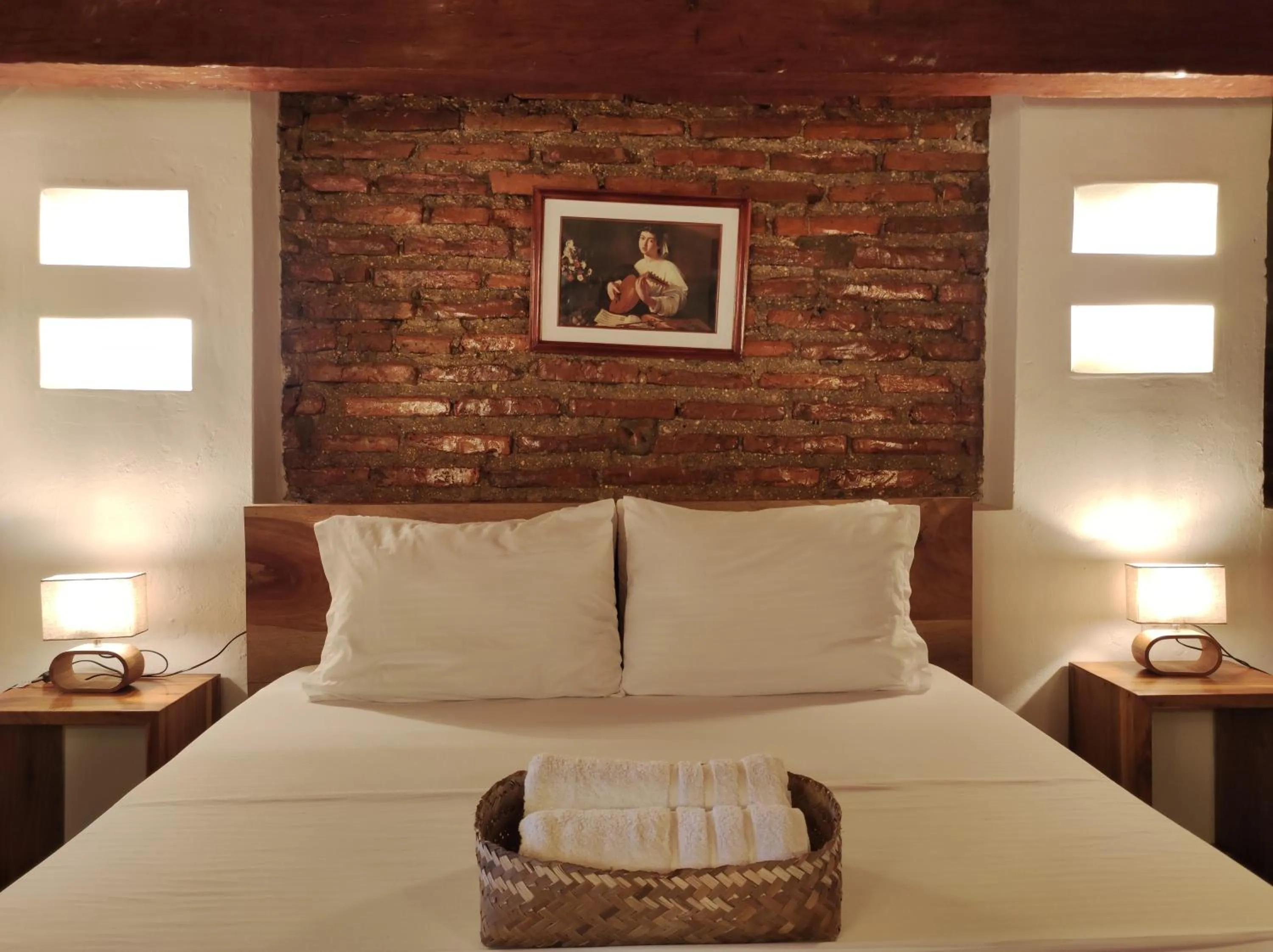 Bed in HOTEL NIETO MOMPOX, ubicado en el corazón del centro histórico, frente al rio magdalena en zona de malecón