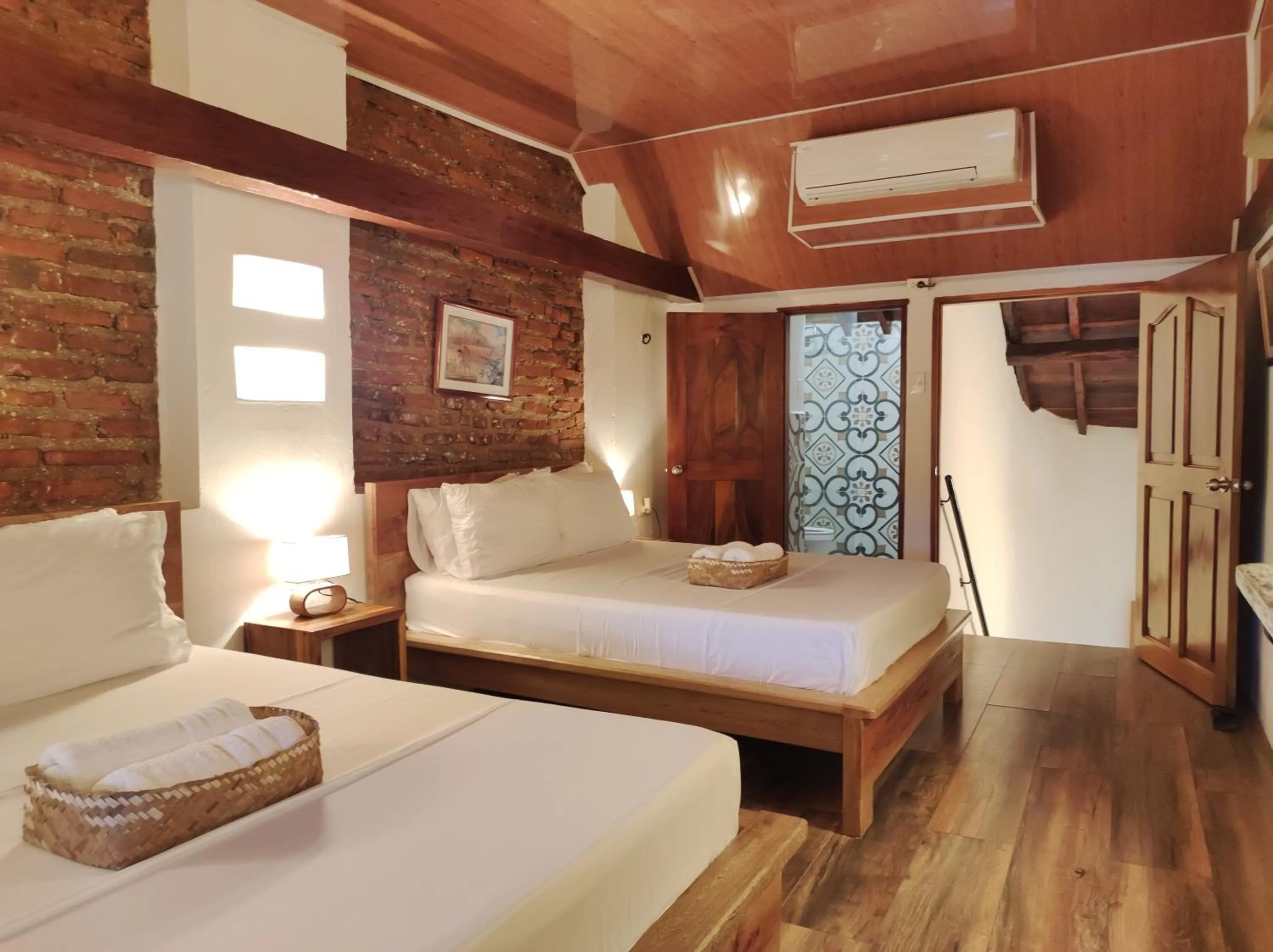 Bed in HOTEL NIETO MOMPOX, ubicado en el corazón del centro histórico, frente al rio magdalena en zona de malecón